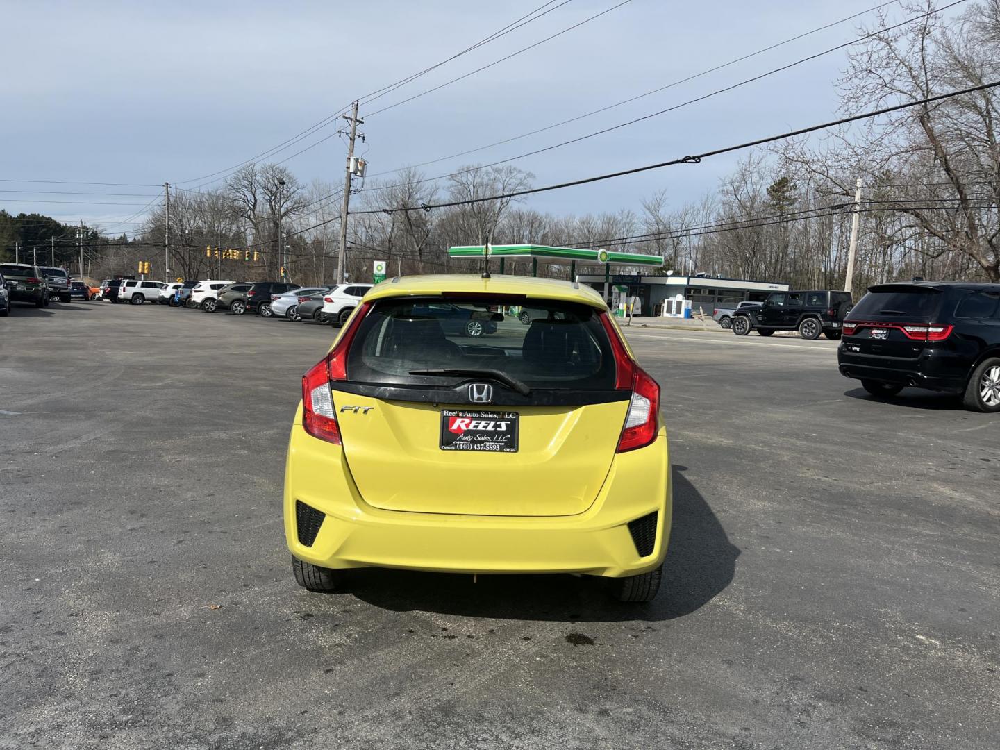 2015 Yellow /Black Honda Fit LX (3HGGK5H56FM) with an 1.5L I4 DOHC 16V engine, Automatic transmission, located at 11115 Chardon Rd. , Chardon, OH, 44024, (440) 214-9705, 41.580246, -81.241943 - 2015 Honda Fit LX – Super-Efficient Hatchback with Fun Personality and Eye-Catching Style! This zippy 2015 Honda Fit LX is the ultimate smart buy for anyone wanting maximum fun, space, and fuel savings in a compact package! Powered by Honda’s reliable 1.5L I4 Earth Dreams engine, it delivers pe - Photo#7