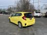 2015 Yellow /Black Honda Fit LX (3HGGK5H56FM) with an 1.5L I4 DOHC 16V engine, Automatic transmission, located at 11115 Chardon Rd. , Chardon, OH, 44024, (440) 214-9705, 41.580246, -81.241943 - 2015 Honda Fit LX – Super-Efficient Hatchback with Fun Personality and Eye-Catching Style! This zippy 2015 Honda Fit LX is the ultimate smart buy for anyone wanting maximum fun, space, and fuel savings in a compact package! Powered by Honda’s reliable 1.5L I4 Earth Dreams engine, it delivers pe - Photo#8