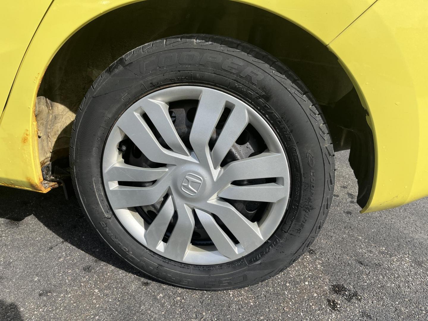 2015 Yellow /Black Honda Fit LX (3HGGK5H56FM) with an 1.5L I4 DOHC 16V engine, Automatic transmission, located at 11115 Chardon Rd. , Chardon, OH, 44024, (440) 214-9705, 41.580246, -81.241943 - 2015 Honda Fit LX – Super-Efficient Hatchback with Fun Personality and Eye-Catching Style! This zippy 2015 Honda Fit LX is the ultimate smart buy for anyone wanting maximum fun, space, and fuel savings in a compact package! Powered by Honda’s reliable 1.5L I4 Earth Dreams engine, it delivers pe - Photo#11