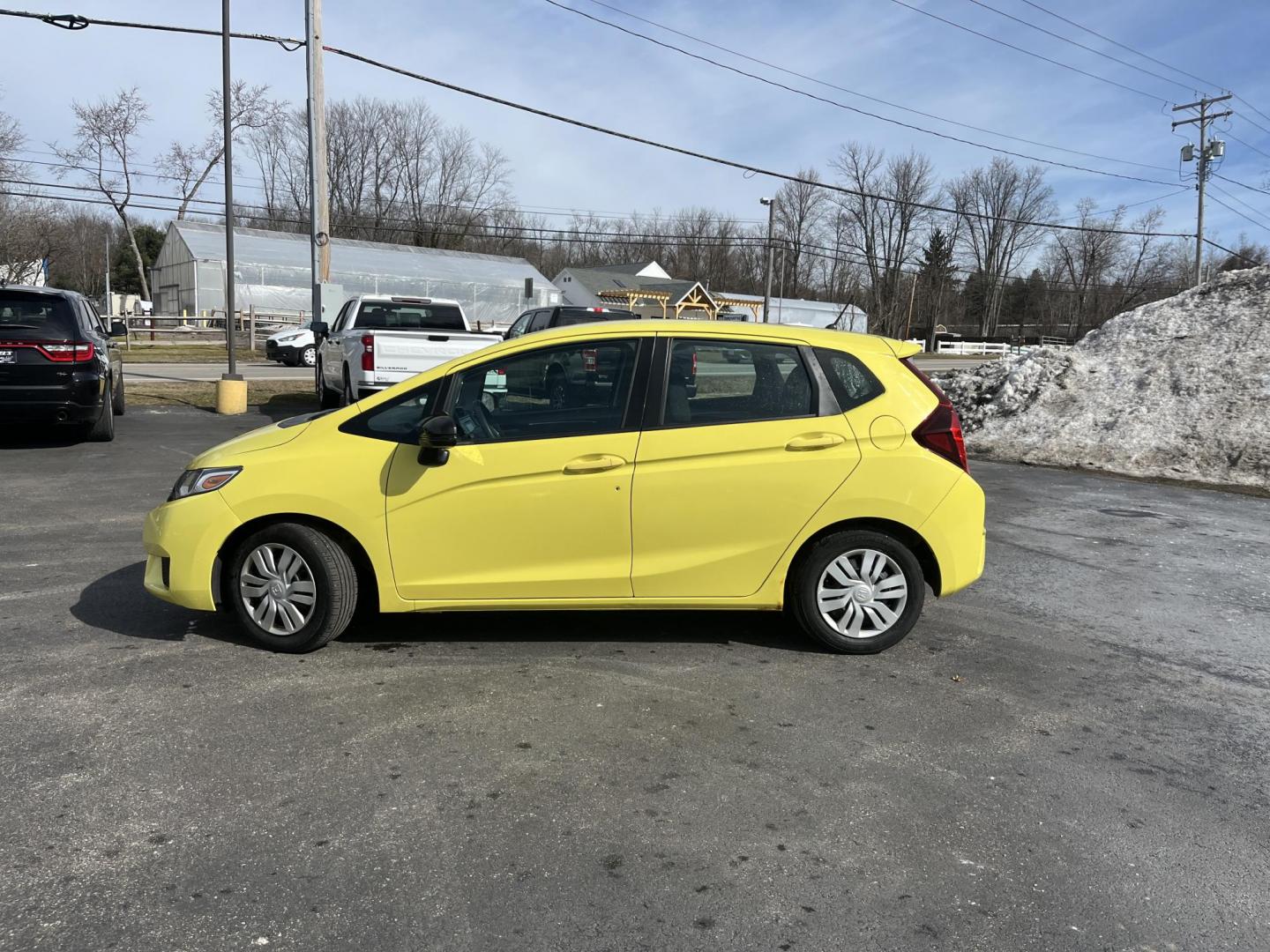2015 Yellow /Black Honda Fit LX (3HGGK5H56FM) with an 1.5L I4 DOHC 16V engine, Automatic transmission, located at 11115 Chardon Rd. , Chardon, OH, 44024, (440) 214-9705, 41.580246, -81.241943 - 2015 Honda Fit LX – Super-Efficient Hatchback with Fun Personality and Eye-Catching Style! This zippy 2015 Honda Fit LX is the ultimate smart buy for anyone wanting maximum fun, space, and fuel savings in a compact package! Powered by Honda’s reliable 1.5L I4 Earth Dreams engine, it delivers pe - Photo#10