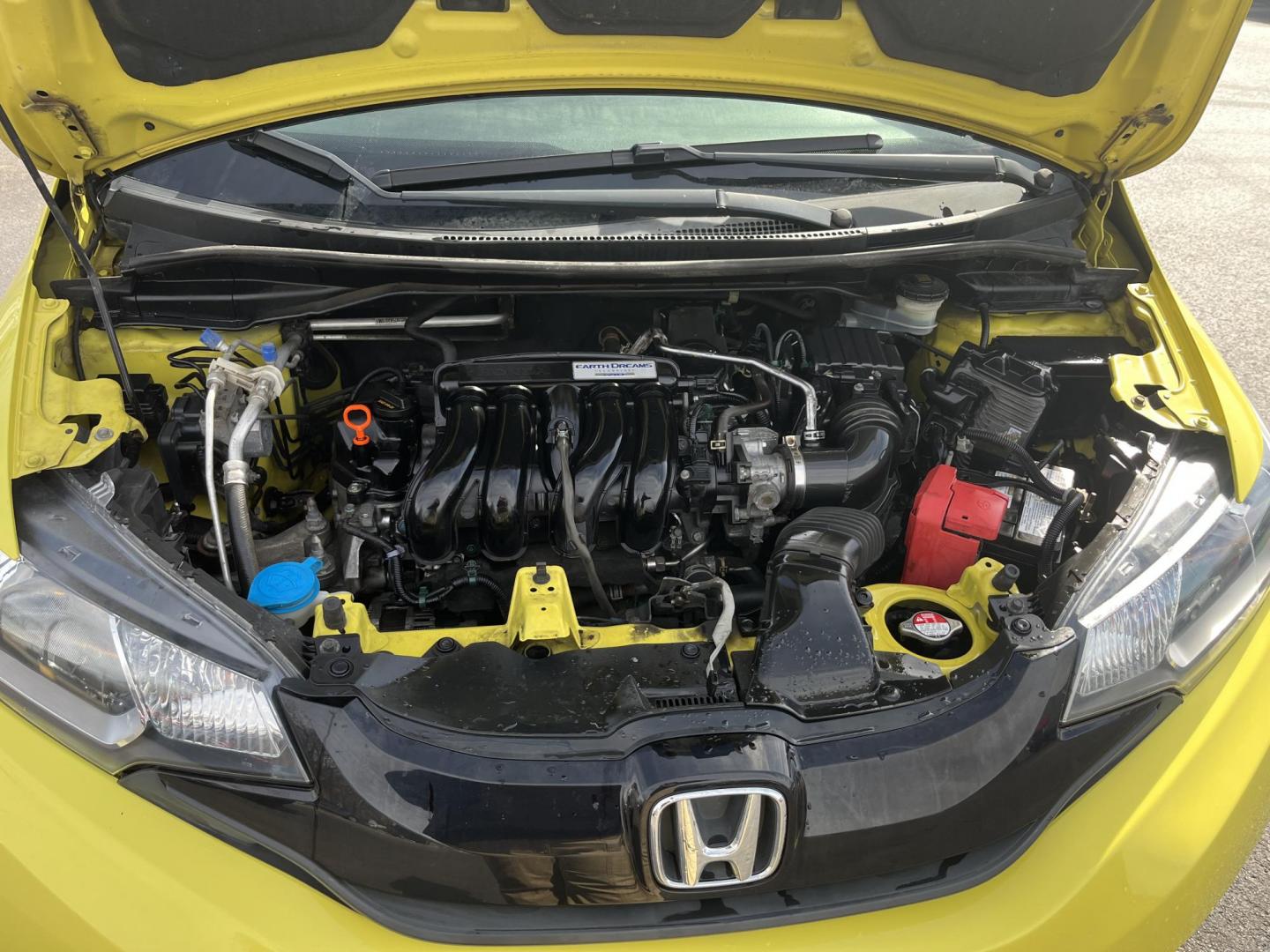 2015 Yellow /Black Honda Fit LX (3HGGK5H56FM) with an 1.5L I4 DOHC 16V engine, Automatic transmission, located at 11115 Chardon Rd. , Chardon, OH, 44024, (440) 214-9705, 41.580246, -81.241943 - 2015 Honda Fit LX – Super-Efficient Hatchback with Fun Personality and Eye-Catching Style! This zippy 2015 Honda Fit LX is the ultimate smart buy for anyone wanting maximum fun, space, and fuel savings in a compact package! Powered by Honda’s reliable 1.5L I4 Earth Dreams engine, it delivers pe - Photo#12