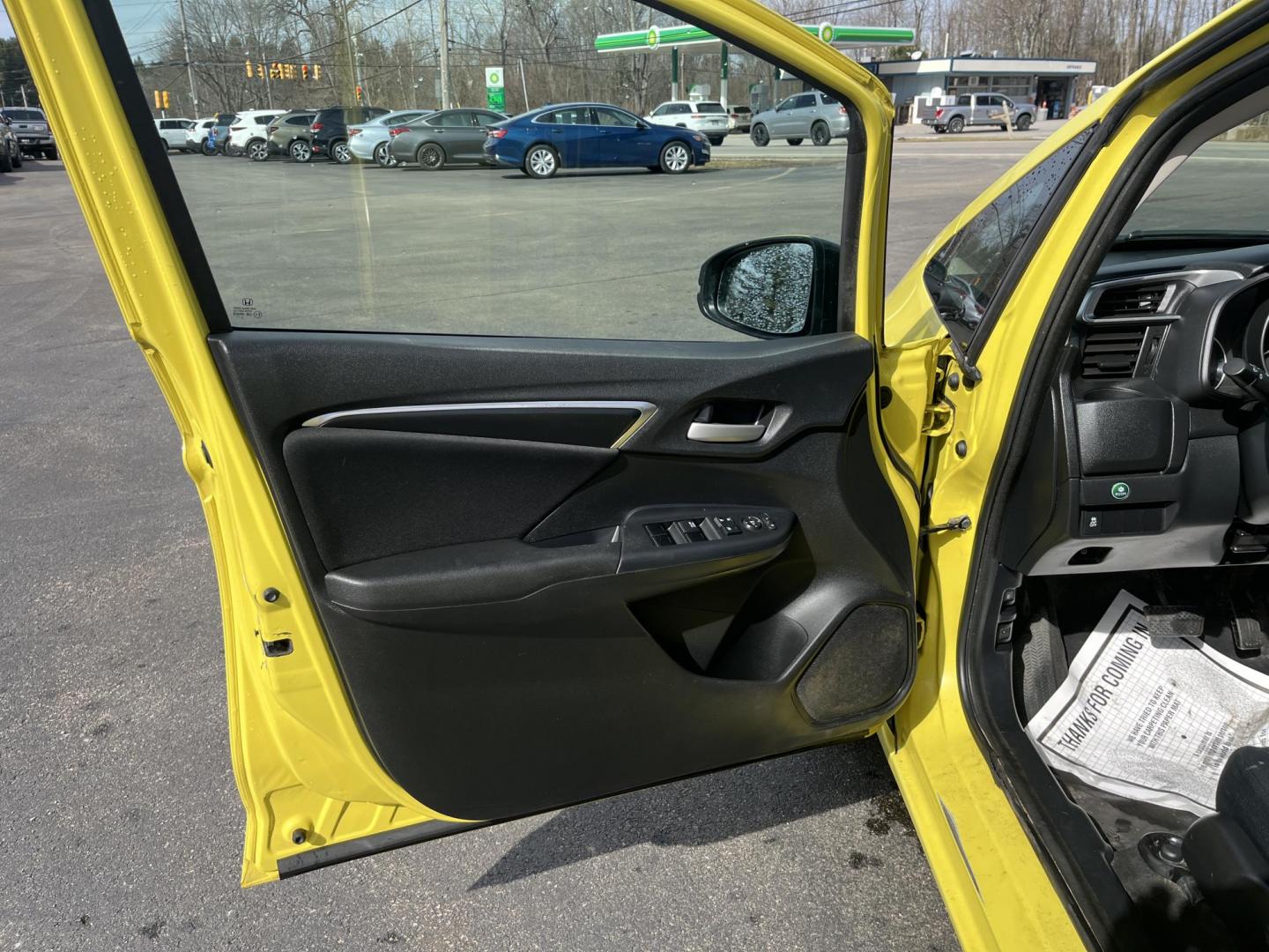 2015 Yellow /Black Honda Fit LX (3HGGK5H56FM) with an 1.5L I4 DOHC 16V engine, Automatic transmission, located at 11115 Chardon Rd. , Chardon, OH, 44024, (440) 214-9705, 41.580246, -81.241943 - 2015 Honda Fit LX – Super-Efficient Hatchback with Fun Personality and Eye-Catching Style! This zippy 2015 Honda Fit LX is the ultimate smart buy for anyone wanting maximum fun, space, and fuel savings in a compact package! Powered by Honda’s reliable 1.5L I4 Earth Dreams engine, it delivers pe - Photo#14