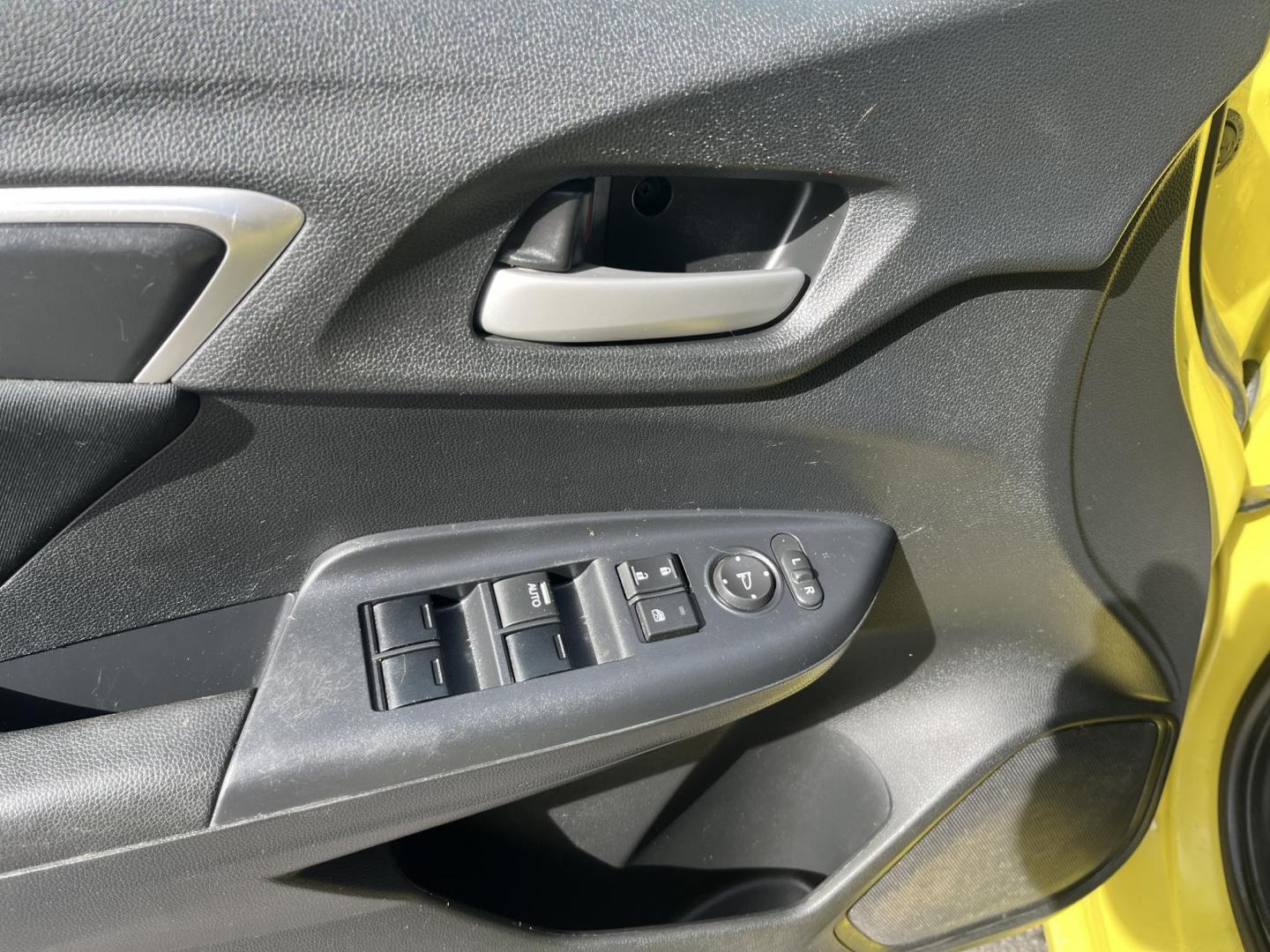 2015 Yellow /Black Honda Fit LX (3HGGK5H56FM) with an 1.5L I4 DOHC 16V engine, Automatic transmission, located at 11115 Chardon Rd. , Chardon, OH, 44024, (440) 214-9705, 41.580246, -81.241943 - 2015 Honda Fit LX – Super-Efficient Hatchback with Fun Personality and Eye-Catching Style! This zippy 2015 Honda Fit LX is the ultimate smart buy for anyone wanting maximum fun, space, and fuel savings in a compact package! Powered by Honda’s reliable 1.5L I4 Earth Dreams engine, it delivers pe - Photo#15