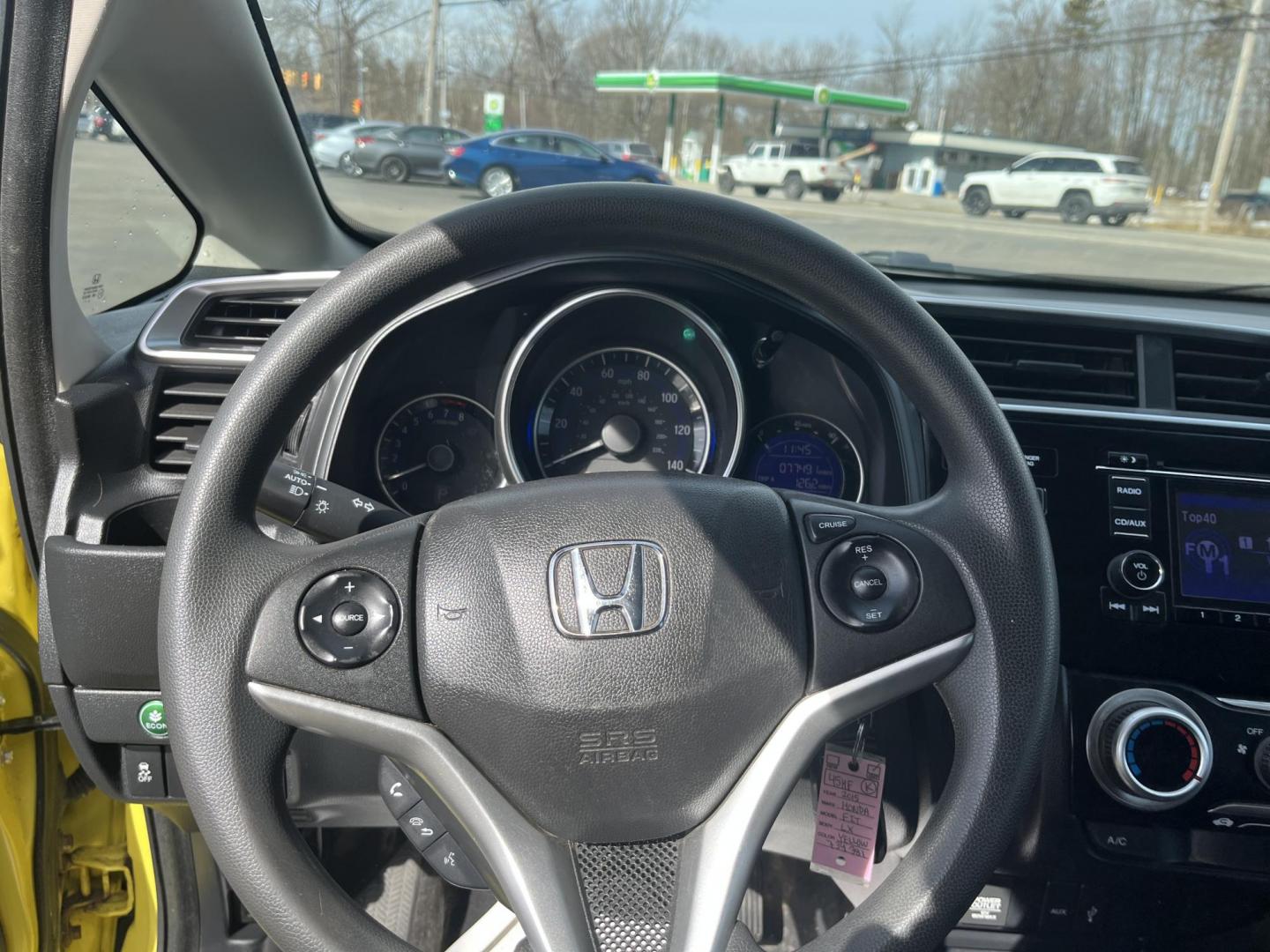 2015 Yellow /Black Honda Fit LX (3HGGK5H56FM) with an 1.5L I4 DOHC 16V engine, Automatic transmission, located at 11115 Chardon Rd. , Chardon, OH, 44024, (440) 214-9705, 41.580246, -81.241943 - 2015 Honda Fit LX – Super-Efficient Hatchback with Fun Personality and Eye-Catching Style! This zippy 2015 Honda Fit LX is the ultimate smart buy for anyone wanting maximum fun, space, and fuel savings in a compact package! Powered by Honda’s reliable 1.5L I4 Earth Dreams engine, it delivers pe - Photo#18