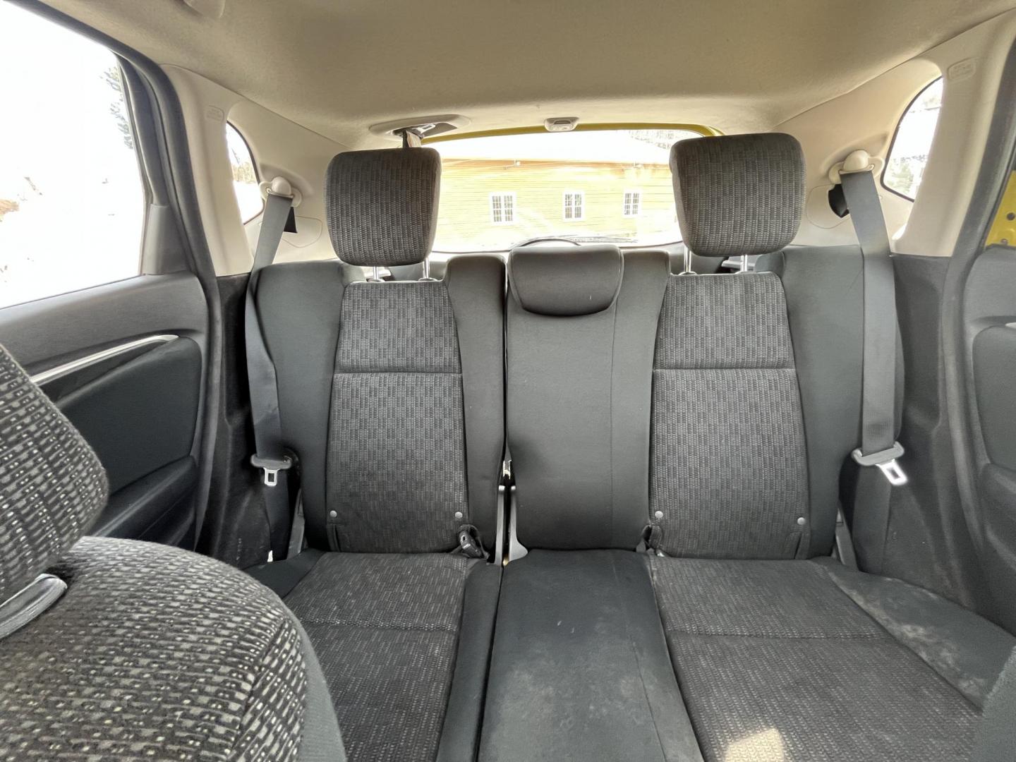 2015 Yellow /Black Honda Fit LX (3HGGK5H56FM) with an 1.5L I4 DOHC 16V engine, Automatic transmission, located at 11115 Chardon Rd. , Chardon, OH, 44024, (440) 214-9705, 41.580246, -81.241943 - 2015 Honda Fit LX – Super-Efficient Hatchback with Fun Personality and Eye-Catching Style! This zippy 2015 Honda Fit LX is the ultimate smart buy for anyone wanting maximum fun, space, and fuel savings in a compact package! Powered by Honda’s reliable 1.5L I4 Earth Dreams engine, it delivers pe - Photo#24