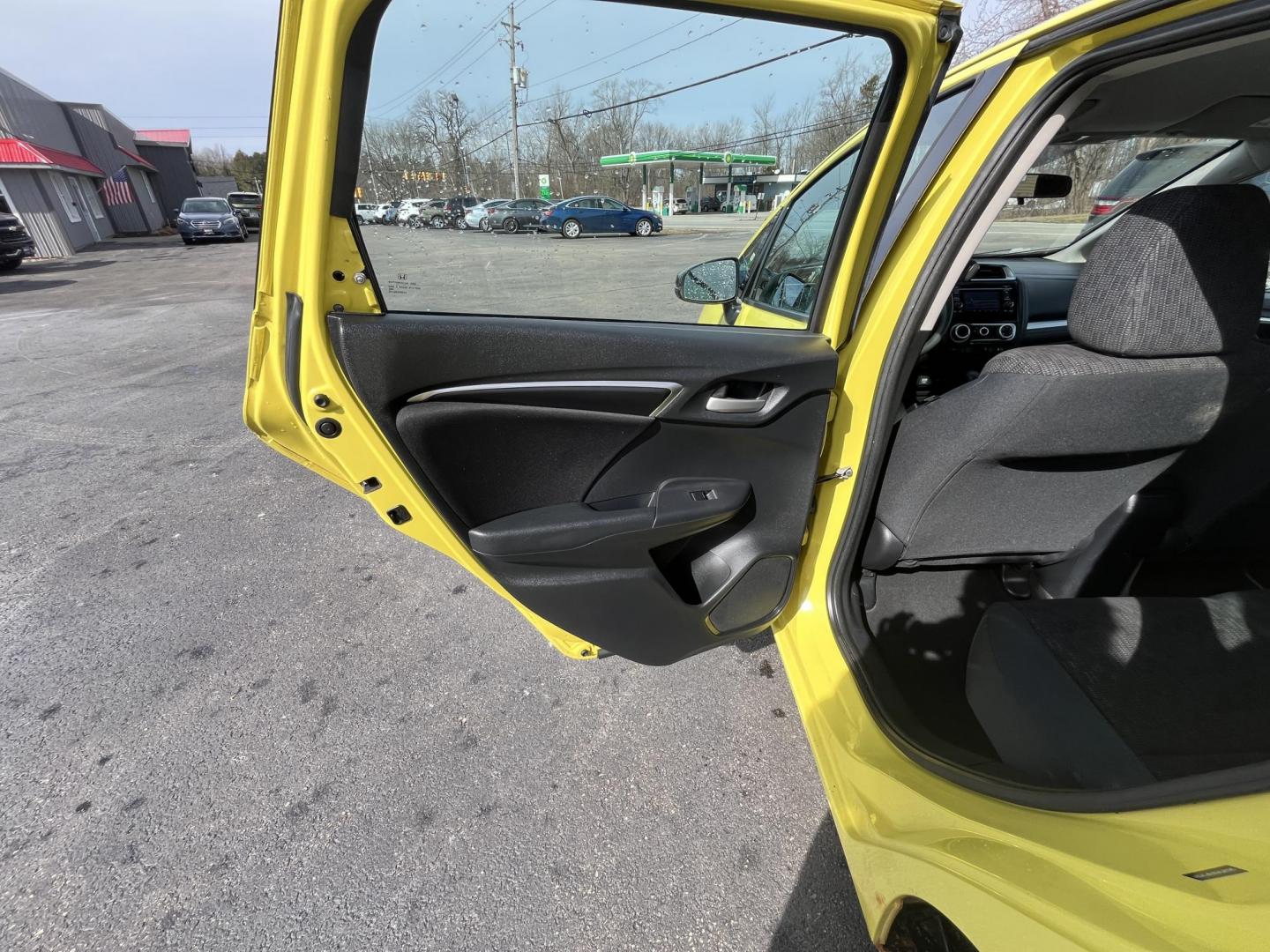 2015 Yellow /Black Honda Fit LX (3HGGK5H56FM) with an 1.5L I4 DOHC 16V engine, Automatic transmission, located at 11115 Chardon Rd. , Chardon, OH, 44024, (440) 214-9705, 41.580246, -81.241943 - 2015 Honda Fit LX – Super-Efficient Hatchback with Fun Personality and Eye-Catching Style! This zippy 2015 Honda Fit LX is the ultimate smart buy for anyone wanting maximum fun, space, and fuel savings in a compact package! Powered by Honda’s reliable 1.5L I4 Earth Dreams engine, it delivers pe - Photo#25