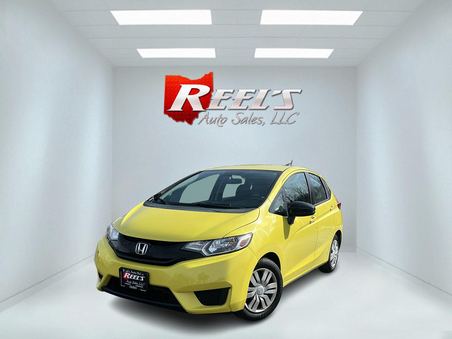 2015 Yellow /Black Honda Fit LX (3HGGK5H56FM) with an 1.5L I4 DOHC 16V engine, Automatic transmission, located at 11115 Chardon Rd. , Chardon, OH, 44024, (440) 214-9705, 41.580246, -81.241943 - 2015 Honda Fit LX – Super-Efficient Hatchback with Fun Personality and Eye-Catching Style! This zippy 2015 Honda Fit LX is the ultimate smart buy for anyone wanting maximum fun, space, and fuel savings in a compact package! Powered by Honda’s reliable 1.5L I4 Earth Dreams engine, it delivers pe - Photo#0