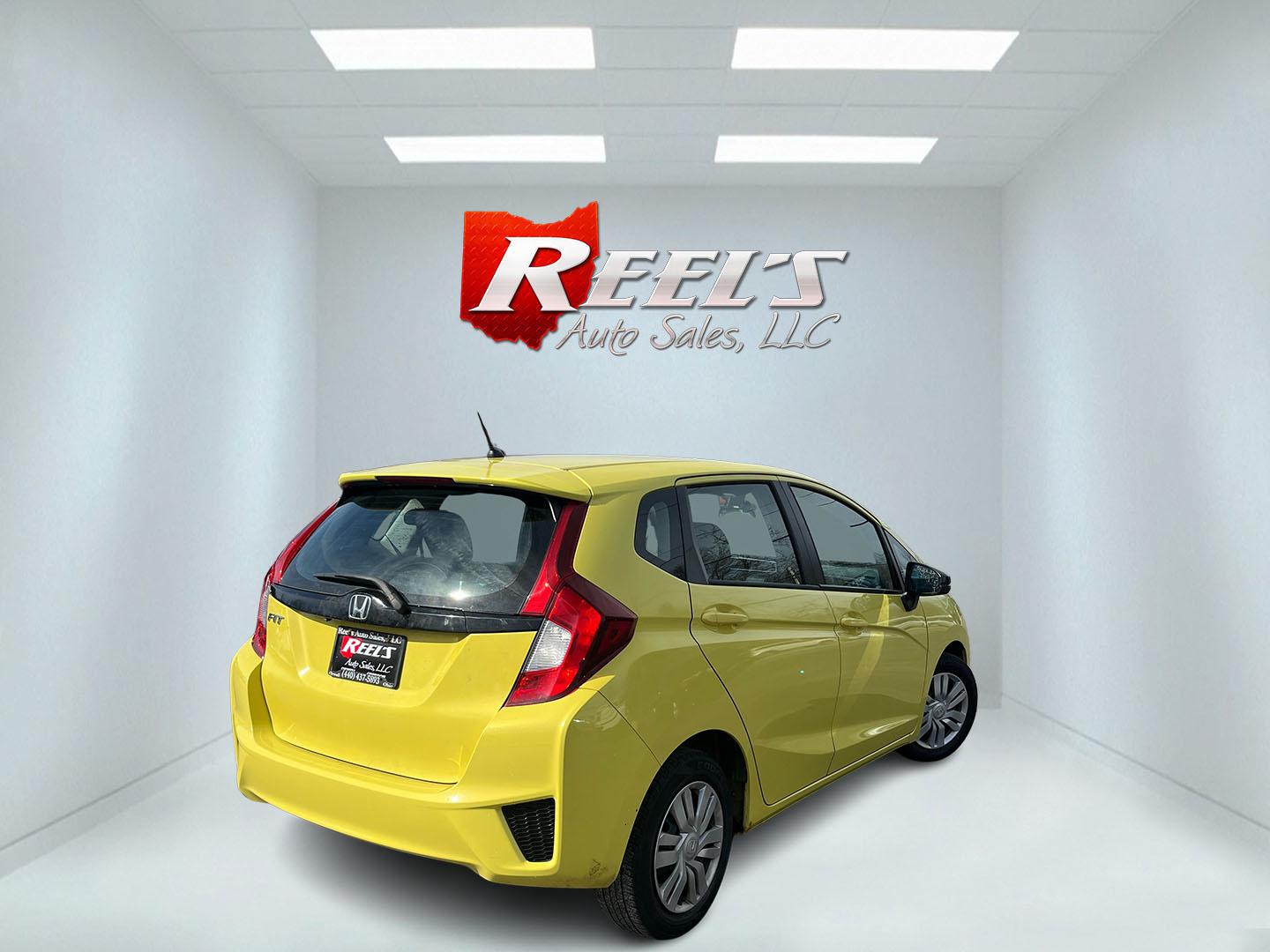 2015 Yellow /Black Honda Fit LX (3HGGK5H56FM) with an 1.5L I4 DOHC 16V engine, Automatic transmission, located at 11115 Chardon Rd. , Chardon, OH, 44024, (440) 214-9705, 41.580246, -81.241943 - 2015 Honda Fit LX – Super-Efficient Hatchback with Fun Personality and Eye-Catching Style! This zippy 2015 Honda Fit LX is the ultimate smart buy for anyone wanting maximum fun, space, and fuel savings in a compact package! Powered by Honda’s reliable 1.5L I4 Earth Dreams engine, it delivers pe - Photo#5