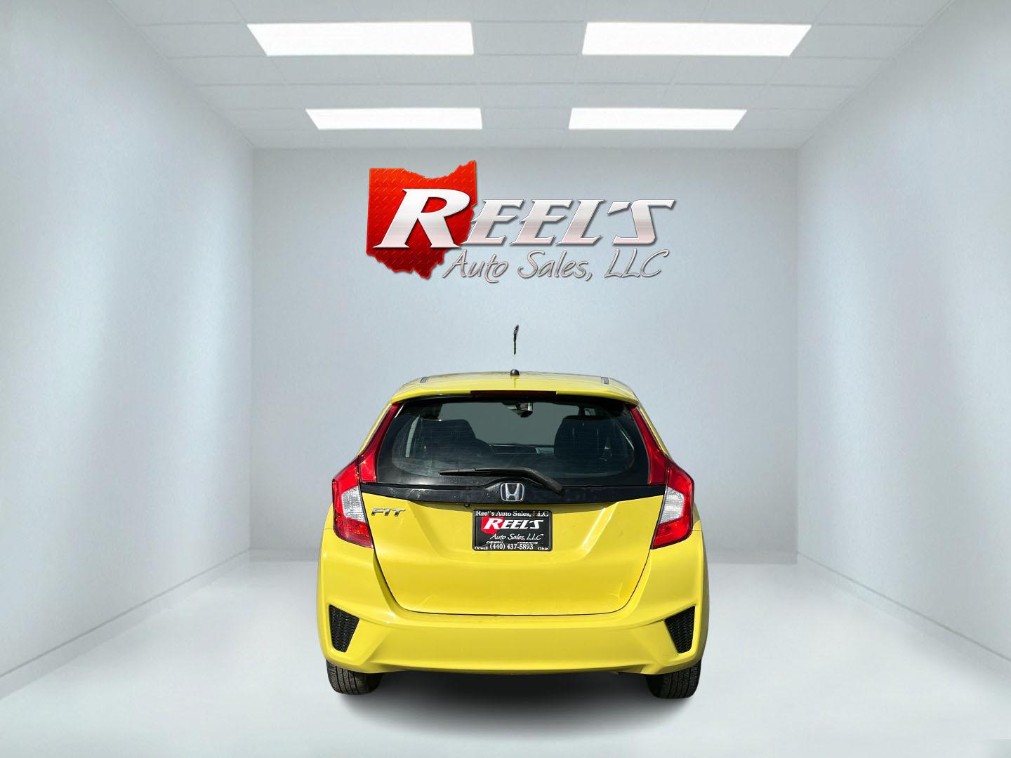 2015 Yellow /Black Honda Fit LX (3HGGK5H56FM) with an 1.5L I4 DOHC 16V engine, Automatic transmission, located at 11115 Chardon Rd. , Chardon, OH, 44024, (440) 214-9705, 41.580246, -81.241943 - 2015 Honda Fit LX – Super-Efficient Hatchback with Fun Personality and Eye-Catching Style! This zippy 2015 Honda Fit LX is the ultimate smart buy for anyone wanting maximum fun, space, and fuel savings in a compact package! Powered by Honda’s reliable 1.5L I4 Earth Dreams engine, it delivers pe - Photo#7