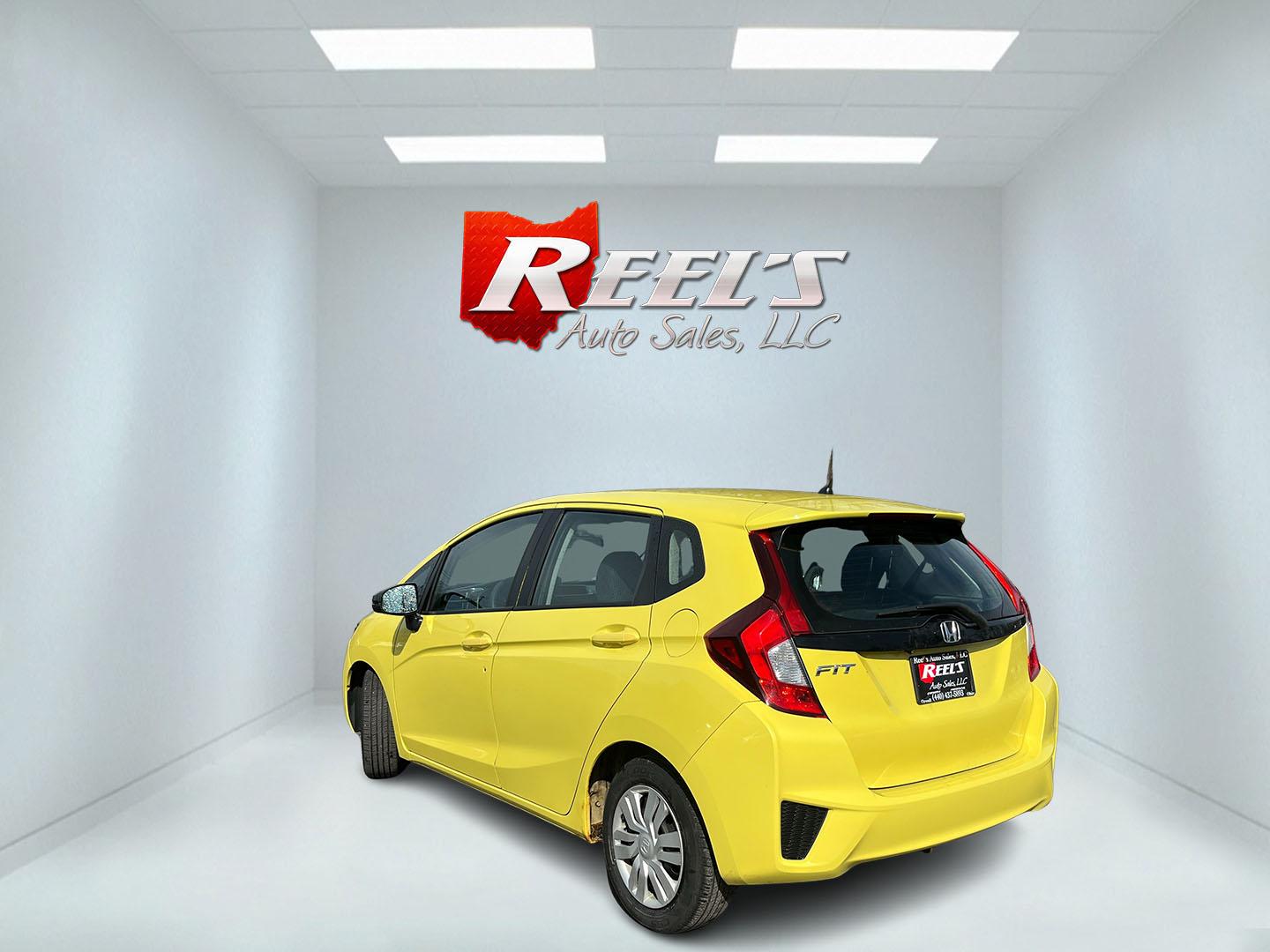 2015 Yellow /Black Honda Fit LX (3HGGK5H56FM) with an 1.5L I4 DOHC 16V engine, Automatic transmission, located at 11115 Chardon Rd. , Chardon, OH, 44024, (440) 214-9705, 41.580246, -81.241943 - 2015 Honda Fit LX – Super-Efficient Hatchback with Fun Personality and Eye-Catching Style! This zippy 2015 Honda Fit LX is the ultimate smart buy for anyone wanting maximum fun, space, and fuel savings in a compact package! Powered by Honda’s reliable 1.5L I4 Earth Dreams engine, it delivers pe - Photo#8