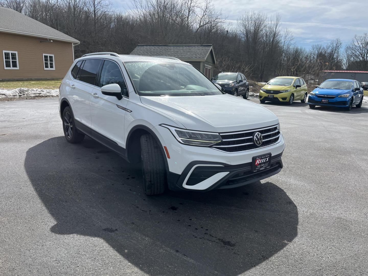 2022 White /Black Volkswagen Tiguan SE 4Motion (3VV2B7AX6NM) with an 2.0L I4 DOHC 16V Turbo engine, Automatic transmission, located at 11115 Chardon Rd. , Chardon, OH, 44024, (440) 214-9705, 41.580246, -81.241943 - 2022 Volkswagen Tiguan SE AWD – Premium Comfort, All-Weather Confidence, and Loaded with Advanced Safety & Tech! This 2022 Volkswagen Tiguan SE AWD is the perfect upscale crossover that’s ready for family adventures, daily commutes, or weekend getaways! Powered by a responsive 2.0L Turbocharged - Photo#2