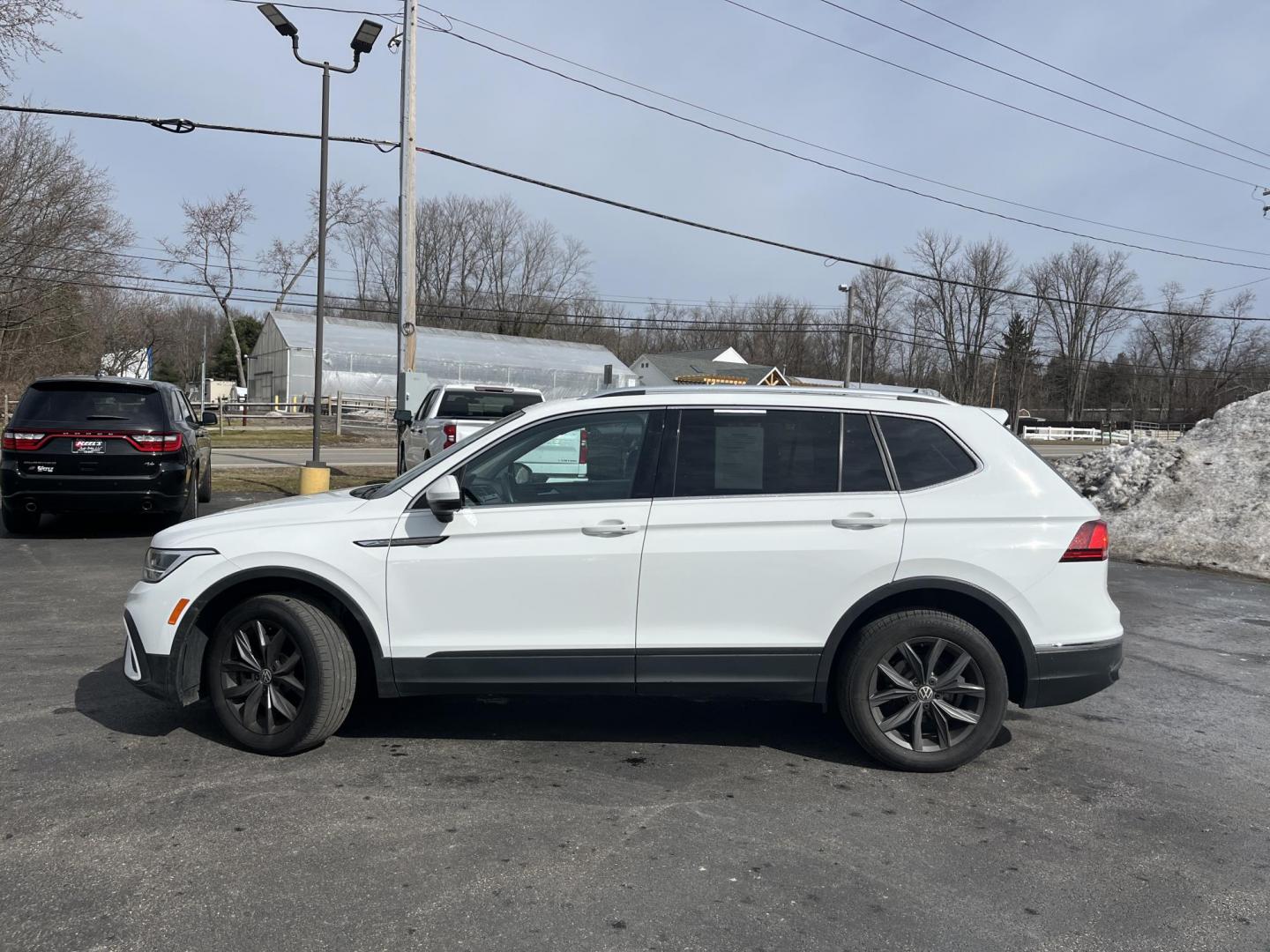 2022 White /Black Volkswagen Tiguan SE 4Motion (3VV2B7AX6NM) with an 2.0L I4 DOHC 16V Turbo engine, Automatic transmission, located at 11115 Chardon Rd. , Chardon, OH, 44024, (440) 214-9705, 41.580246, -81.241943 - 2022 Volkswagen Tiguan SE AWD – Premium Comfort, All-Weather Confidence, and Loaded with Advanced Safety & Tech! This 2022 Volkswagen Tiguan SE AWD is the perfect upscale crossover that’s ready for family adventures, daily commutes, or weekend getaways! Powered by a responsive 2.0L Turbocharged - Photo#11