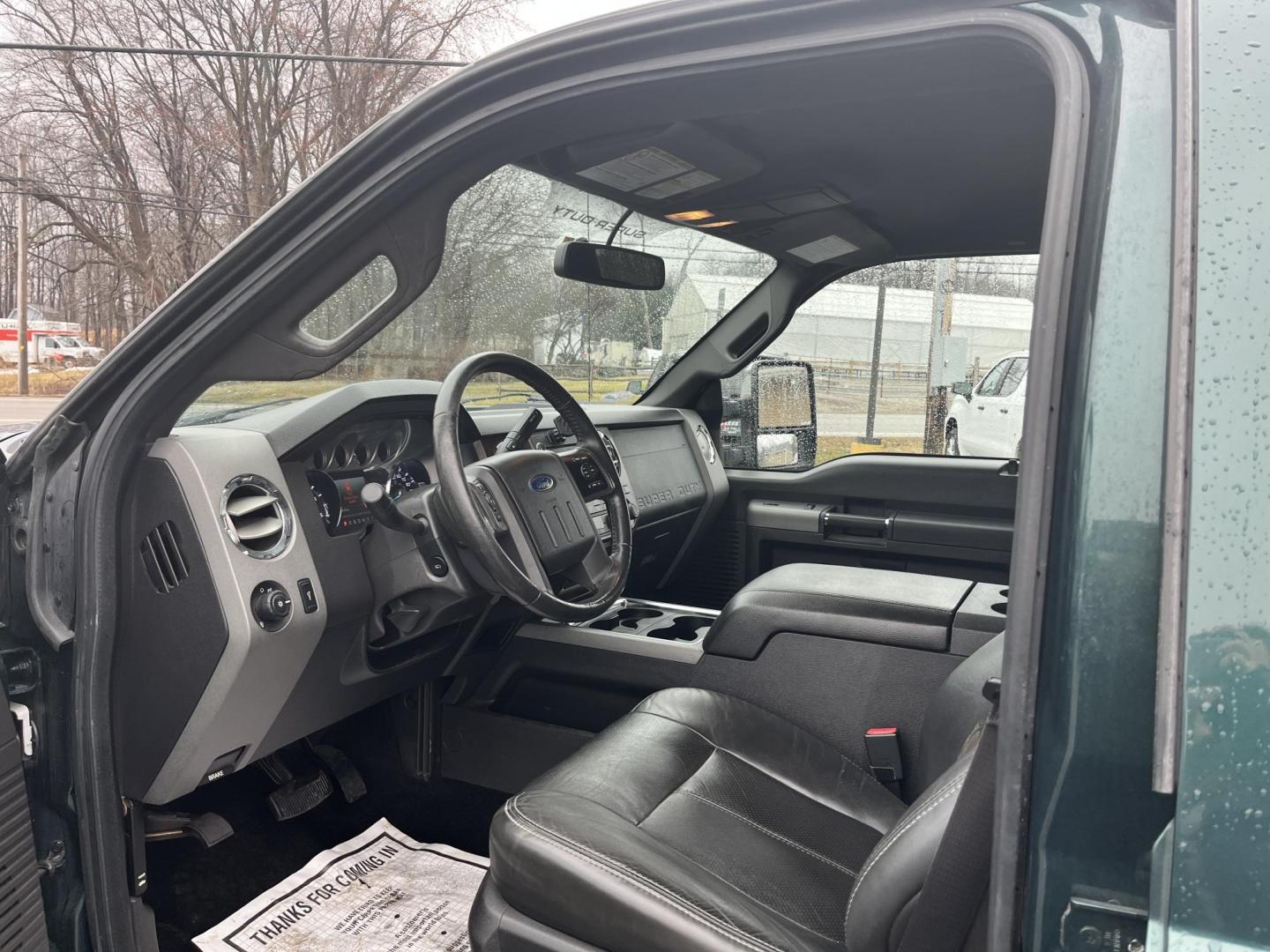 2011 Green /Black Ford F-250 SD Lariat Crew Cab 4WD (1FT7W2BT9BE) with an 6.7L V8 OHV 16V DIESEL engine, Automatic transmission, located at 11115 Chardon Rd. , Chardon, OH, 44024, (440) 214-9705, 41.580246, -81.241943 - 2011 Ford F-250 Lariat Crew Cab 4x4 – Heavy-Duty Legend with Power Stroke Diesel Muscle and Premium Lariat Comfort! This beast of a 2011 Ford F-250 Lariat Crew Cab is built to dominate work sites, towing jobs, and long hauls with legendary reliability! Under the hood roars the iconic 6.7L Power S - Photo#18
