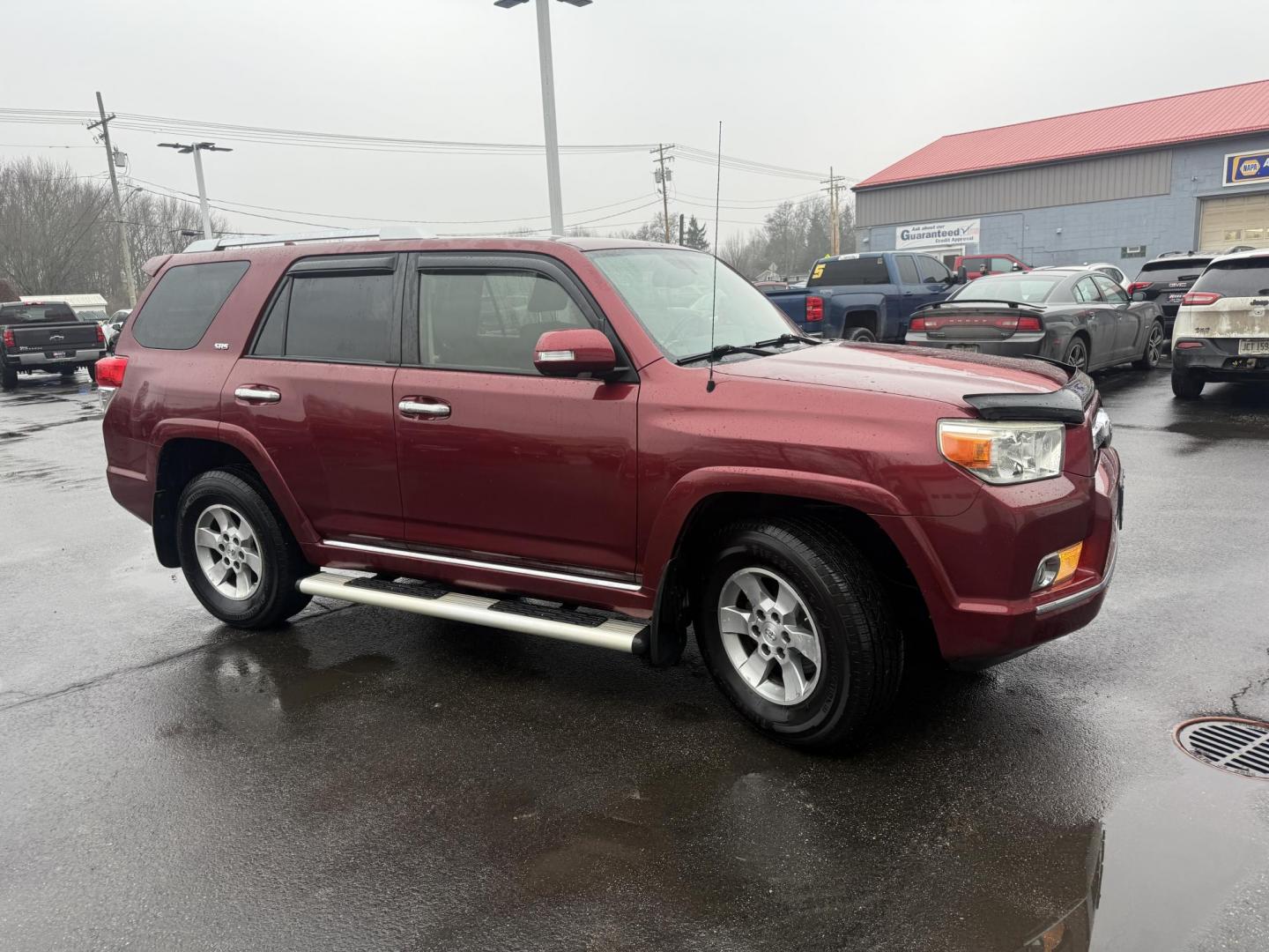 2013 Red /Black Toyota 4Runner SR5 4WD (JTEBU5JR2D5) with an 4.0L V6 DOHC 24V engine, Automatic transmission, located at 547 E. Main St., Orwell, OH, 44076, (440) 437-5893, 41.535435, -80.847855 - 2013 Toyota 4Runner SR5 4WD – Legendary Reliability, Off-Road Ready, and Packed with Practical Features! This rugged 2013 Toyota 4Runner SR5 4WD is the timeless SUV built to last a lifetime and tackle anything you throw at it! Powered by the bulletproof 4.0L V6 engine mated to a durable 5-speed a - Photo#3
