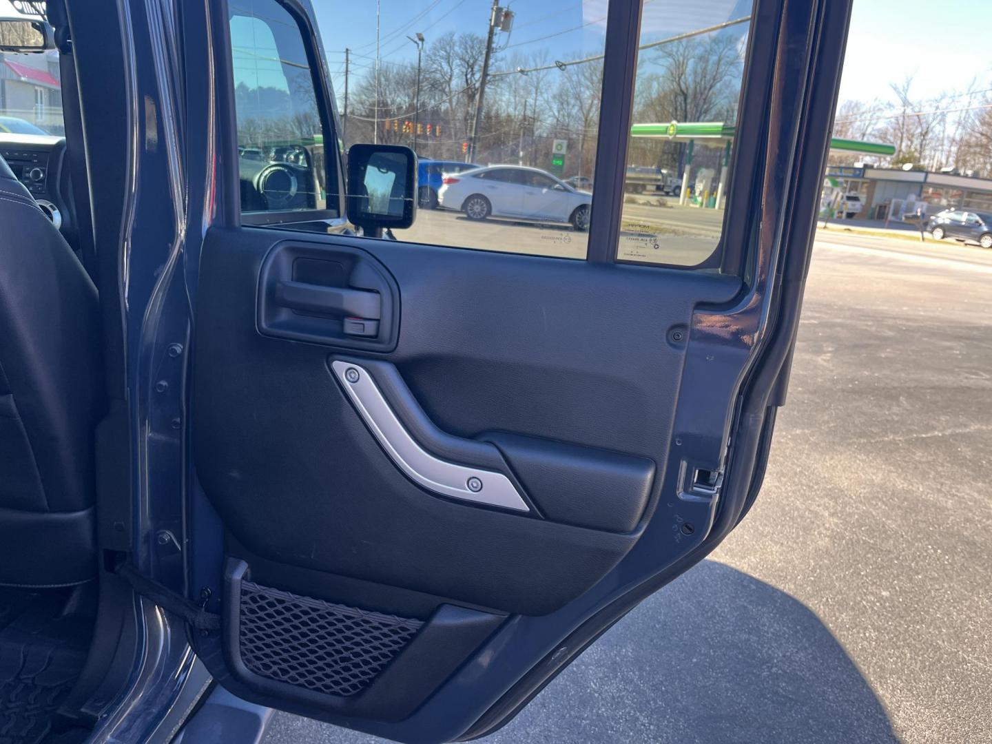 2017 Gray /Black Jeep Wrangler Unlimited Sahara 4WD (1C4BJWEG8HL) with an 3.6L V6 DOHC 24V engine, Automatic transmission, located at 11115 Chardon Rd. , Chardon, OH, 44024, (440) 214-9705, 41.580246, -81.241943 - 2017 Jeep Wrangler Unlimited Chief Edition 4WD – Special-Edition Icon with Premium Touches and True Off-Road DNA! This 2017 Jeep Wrangler Unlimited Chief Edition 4WD is a standout collector's gem that blends classic Jeep toughness with exclusive style upgrades! Powered by the reliable 3.6L Pentas - Photo#26