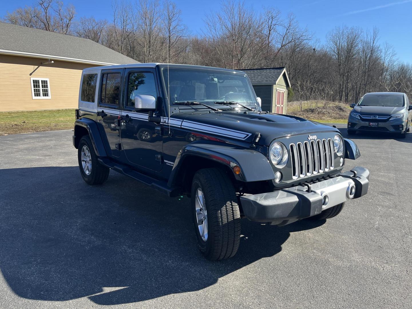 2017 Gray /Black Jeep Wrangler Unlimited Sahara 4WD (1C4BJWEG8HL) with an 3.6L V6 DOHC 24V engine, Automatic transmission, located at 11115 Chardon Rd. , Chardon, OH, 44024, (440) 214-9705, 41.580246, -81.241943 - 2017 Jeep Wrangler Unlimited Chief Edition 4WD – Special-Edition Icon with Premium Touches and True Off-Road DNA! This 2017 Jeep Wrangler Unlimited Chief Edition 4WD is a standout collector's gem that blends classic Jeep toughness with exclusive style upgrades! Powered by the reliable 3.6L Pentas - Photo#2