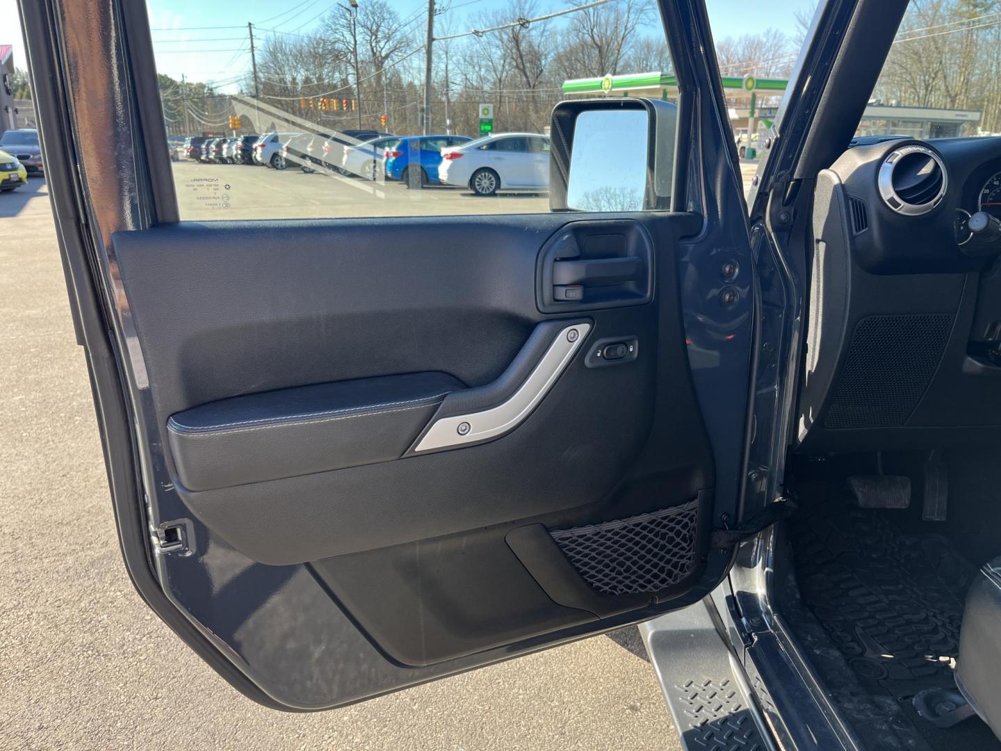 2017 Gray /Black Jeep Wrangler Unlimited Sahara 4WD (1C4BJWEG8HL) with an 3.6L V6 DOHC 24V engine, Automatic transmission, located at 11115 Chardon Rd. , Chardon, OH, 44024, (440) 214-9705, 41.580246, -81.241943 - 2017 Jeep Wrangler Unlimited Chief Edition 4WD – Special-Edition Icon with Premium Touches and True Off-Road DNA! This 2017 Jeep Wrangler Unlimited Chief Edition 4WD is a standout collector's gem that blends classic Jeep toughness with exclusive style upgrades! Powered by the reliable 3.6L Pentas - Photo#15