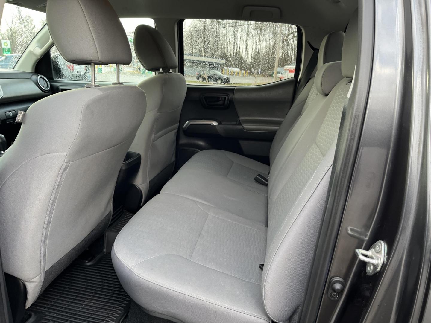 2019 Gray /Black Toyota Tacoma SR5 Double Cab Short Bed V6 6AT 4WD (3TMCZ5AN0KM) with an 3.6L V6 DOHC 24V engine, Automatic transmission, located at 11115 Chardon Rd. , Chardon, OH, 44024, (440) 214-9705, 41.580246, -81.241943 - This 2019 Toyota Tacoma SR5 Double Cab 4WD is a rugged, reliable legend in the making – tough, capable, and looking sharp in Magnetic Gray Metallic with four brand new all-terrain tires ready to hit the trails or the highway! Powered by the potent 3.5L D-4S V6 engine delivering serious torque and - Photo#29