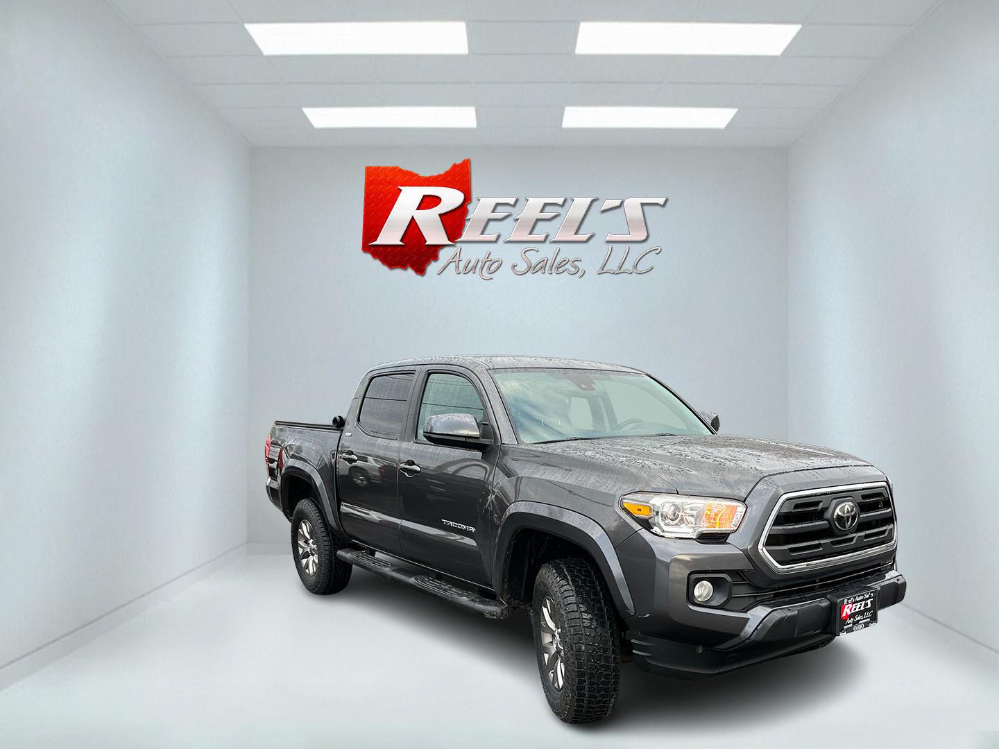 2019 Gray /Black Toyota Tacoma SR5 Double Cab Short Bed V6 6AT 4WD (3TMCZ5AN0KM) with an 3.6L V6 DOHC 24V engine, Automatic transmission, located at 11115 Chardon Rd. , Chardon, OH, 44024, (440) 214-9705, 41.580246, -81.241943 - This 2019 Toyota Tacoma SR5 Double Cab 4WD is a rugged, reliable legend in the making – tough, capable, and looking sharp in Magnetic Gray Metallic with four brand new all-terrain tires ready to hit the trails or the highway! Powered by the potent 3.5L D-4S V6 engine delivering serious torque and - Photo#2
