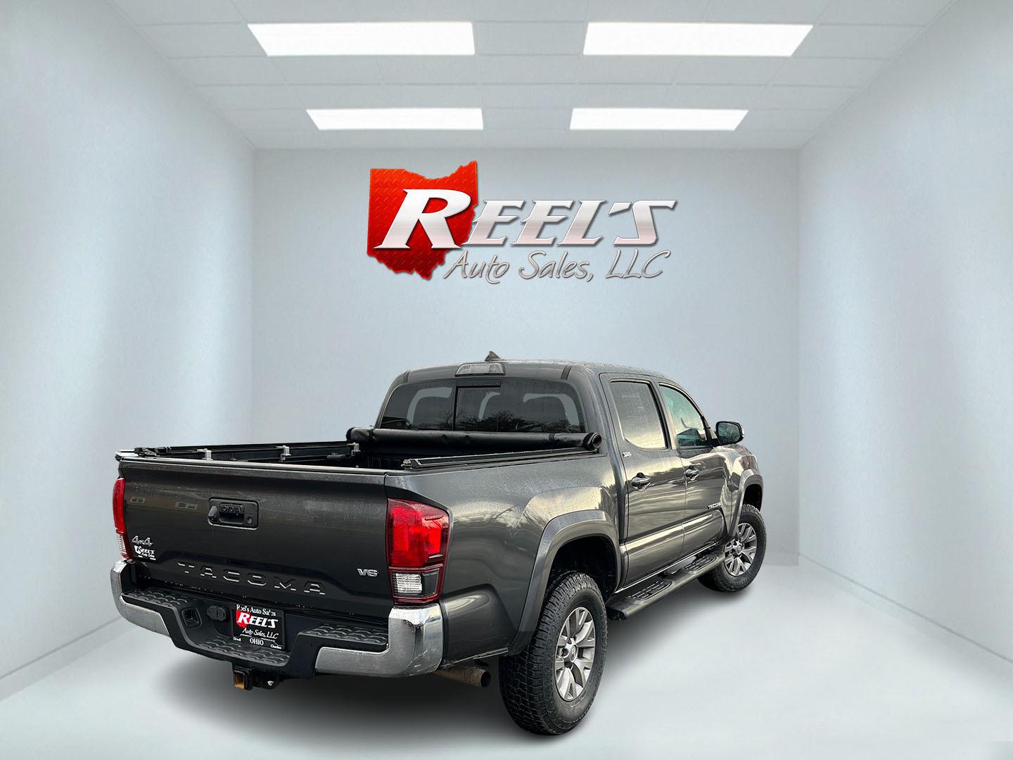 2019 Gray /Black Toyota Tacoma SR5 Double Cab Short Bed V6 6AT 4WD (3TMCZ5AN0KM) with an 3.6L V6 DOHC 24V engine, Automatic transmission, located at 11115 Chardon Rd. , Chardon, OH, 44024, (440) 214-9705, 41.580246, -81.241943 - This 2019 Toyota Tacoma SR5 Double Cab 4WD is a rugged, reliable legend in the making – tough, capable, and looking sharp in Magnetic Gray Metallic with four brand new all-terrain tires ready to hit the trails or the highway! Powered by the potent 3.5L D-4S V6 engine delivering serious torque and - Photo#6