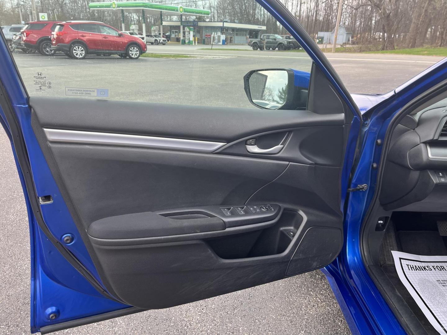 2017 Blue /Black Honda Civic LX Sedan CVT (19XFC2F50HE) with an 2.0L I4 DOHC 16V engine, Automatic transmission, located at 11115 Chardon Rd. , Chardon, OH, 44024, (440) 214-9705, 41.580246, -81.241943 - 2017 Honda Civic LX Sedan – Efficient, Reliable, and Loaded with Smart Features! This clean 2017 Honda Civic LX Sedan is the perfect daily driver that combines excellent fuel economy, modern tech, and Honda’s legendary reliability! Powered by a smooth 2.0L I4 engine, it delivers responsive perf - Photo#15