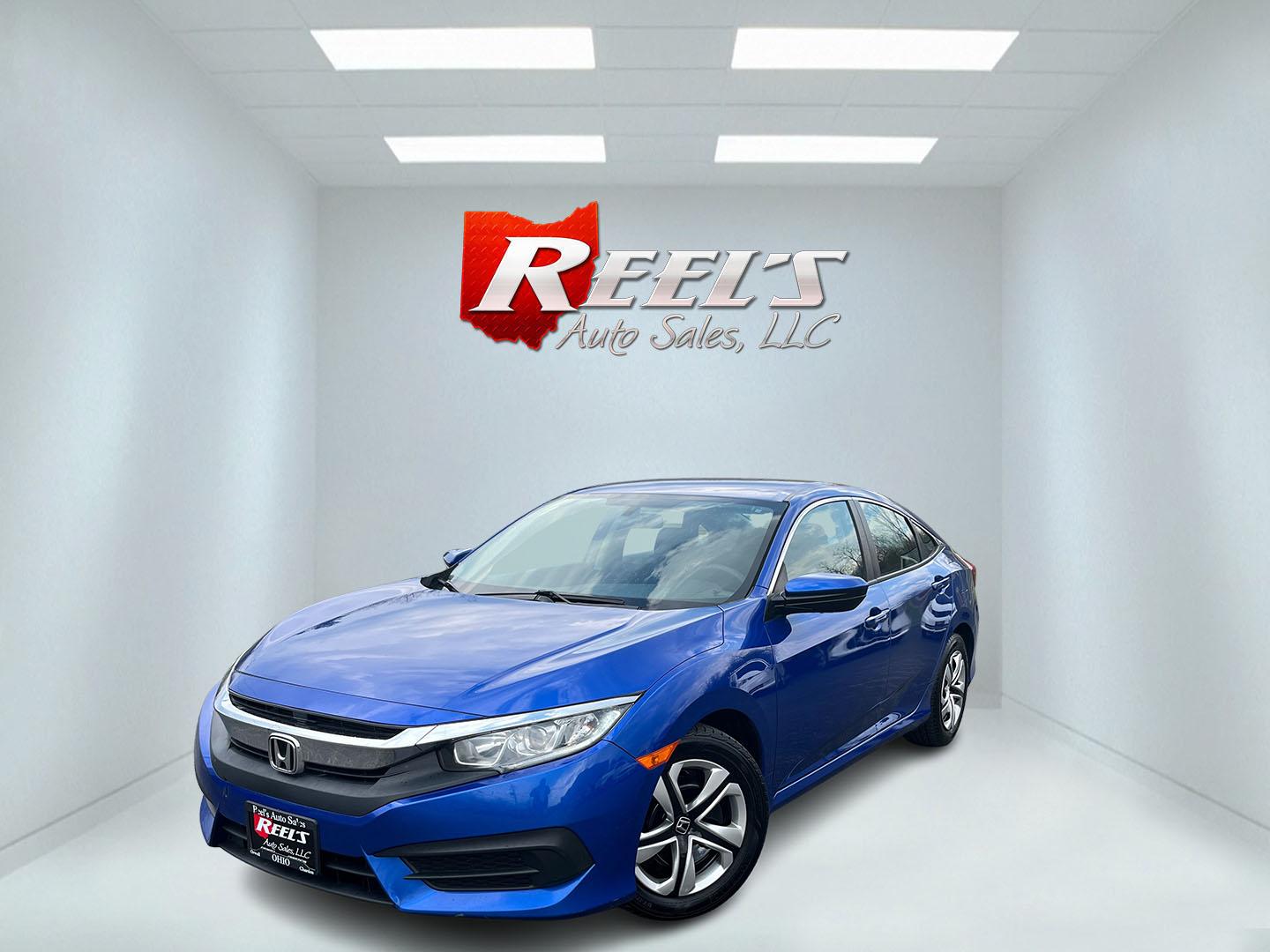 2017 Blue /Black Honda Civic LX Sedan CVT (19XFC2F50HE) with an 2.0L I4 DOHC 16V engine, Automatic transmission, located at 11115 Chardon Rd. , Chardon, OH, 44024, (440) 214-9705, 41.580246, -81.241943 - 2017 Honda Civic LX Sedan – Efficient, Reliable, and Loaded with Smart Features! This clean 2017 Honda Civic LX Sedan is the perfect daily driver that combines excellent fuel economy, modern tech, and Honda’s legendary reliability! Powered by a smooth 2.0L I4 engine, it delivers responsive perf - Photo#0