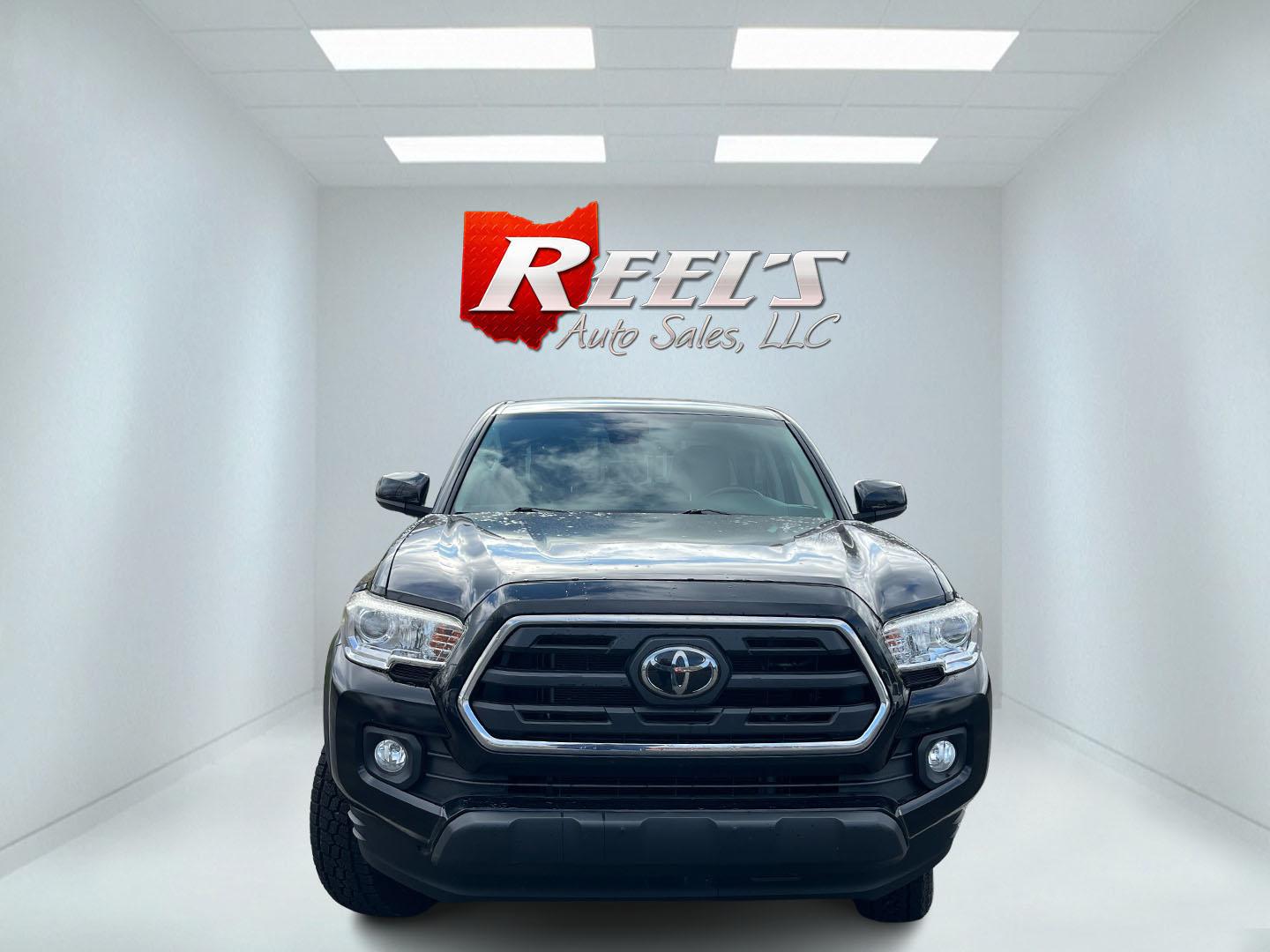 2019 Black /Black Toyota Tacoma SR5 Double Cab Short Bed V6 6AT 4WD (3TMCZ5AN5KM) with an 3.6L V6 DOHC 24V engine, Automatic transmission, located at 11115 Chardon Rd. , Chardon, OH, 44024, (440) 214-9705, 41.580246, -81.241943 - 2019 Toyota Tacoma SR5 Crew Cab 4WD – Rugged, Reliable, and Loaded with Toyota Safety Sense! This 2019 Toyota Tacoma SR5 Crew Cab 4WD is a clean, capable midsize truck that’s built to last and ready for work or weekend adventures! Powered by the strong 3.5L D-4S V6 engine paired with a smooth 6 - Photo#1