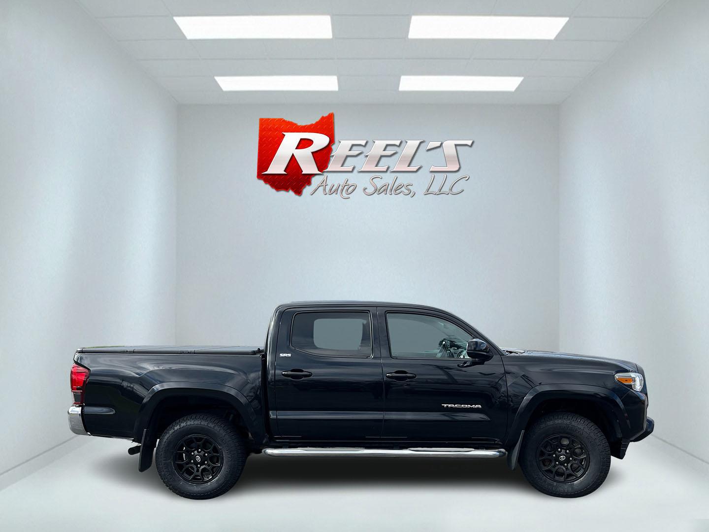 2019 Black /Black Toyota Tacoma SR5 Double Cab Short Bed V6 6AT 4WD (3TMCZ5AN5KM) with an 3.6L V6 DOHC 24V engine, Automatic transmission, located at 11115 Chardon Rd. , Chardon, OH, 44024, (440) 214-9705, 41.580246, -81.241943 - 2019 Toyota Tacoma SR5 Crew Cab 4WD – Rugged, Reliable, and Loaded with Toyota Safety Sense! This 2019 Toyota Tacoma SR5 Crew Cab 4WD is a clean, capable midsize truck that’s built to last and ready for work or weekend adventures! Powered by the strong 3.5L D-4S V6 engine paired with a smooth 6 - Photo#5