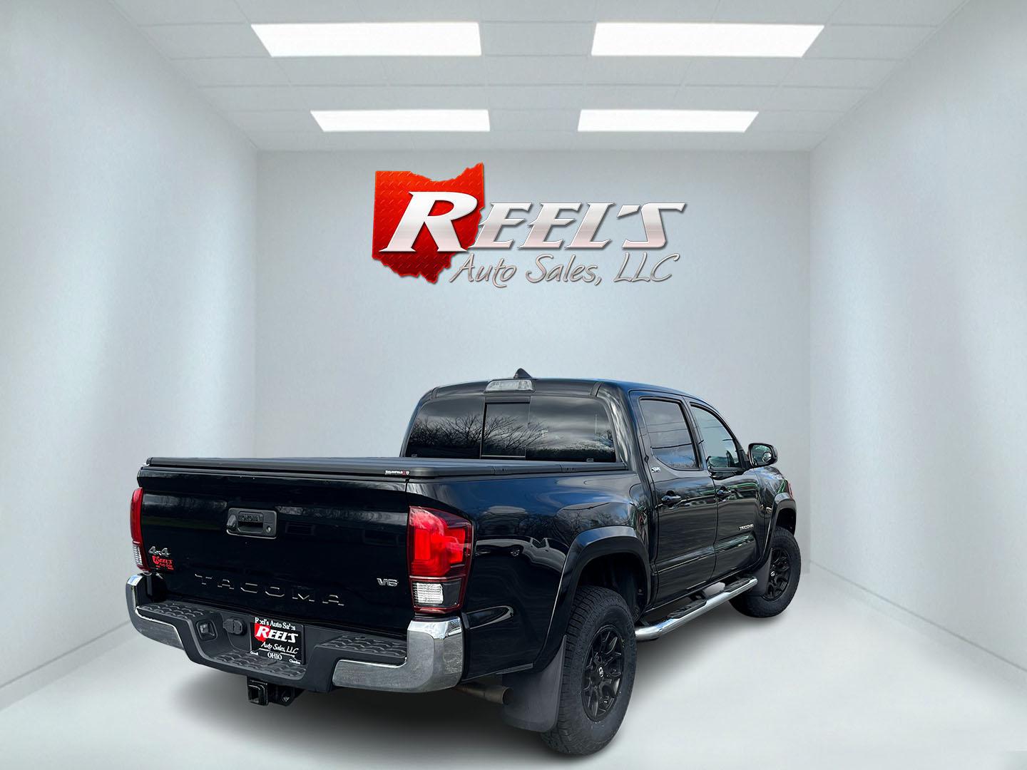 2019 Black /Black Toyota Tacoma SR5 Double Cab Short Bed V6 6AT 4WD (3TMCZ5AN5KM) with an 3.6L V6 DOHC 24V engine, Automatic transmission, located at 11115 Chardon Rd. , Chardon, OH, 44024, (440) 214-9705, 41.580246, -81.241943 - 2019 Toyota Tacoma SR5 Crew Cab 4WD – Rugged, Reliable, and Loaded with Toyota Safety Sense! This 2019 Toyota Tacoma SR5 Crew Cab 4WD is a clean, capable midsize truck that’s built to last and ready for work or weekend adventures! Powered by the strong 3.5L D-4S V6 engine paired with a smooth 6 - Photo#6