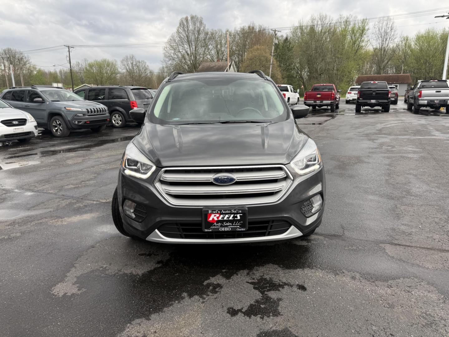 2018 Gray /Black Ford Escape SEL 4WD (1FMCU9HD0JU) with an 1.5L I4 DOHC 16V engine, Automatic transmission, located at 11115 Chardon Rd. , Chardon, OH, 44024, (440) 214-9705, 41.580246, -81.241943 - 2018 Ford Escape SEL 4WD – Turbo Efficiency, Premium Comfort, and All-Weather Confidence! This sharp 2018 Ford Escape SEL 4WD is a great-looking compact crossover that delivers style, comfort, and real capability! Powered by a responsive 1.5L I4 Turbocharged EcoBoost engine paired with a smooth 6 - Photo#1
