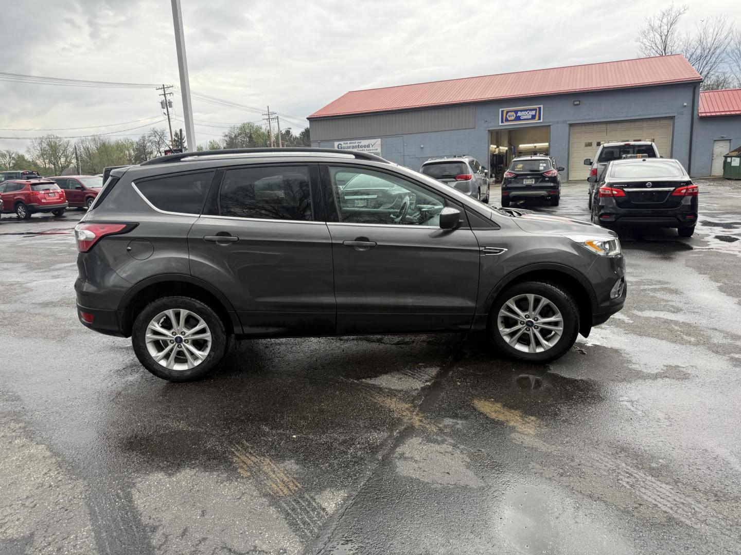 2018 Gray /Black Ford Escape SEL 4WD (1FMCU9HD0JU) with an 1.5L I4 DOHC 16V engine, Automatic transmission, located at 11115 Chardon Rd. , Chardon, OH, 44024, (440) 214-9705, 41.580246, -81.241943 - 2018 Ford Escape SEL 4WD – Turbo Efficiency, Premium Comfort, and All-Weather Confidence! This sharp 2018 Ford Escape SEL 4WD is a great-looking compact crossover that delivers style, comfort, and real capability! Powered by a responsive 1.5L I4 Turbocharged EcoBoost engine paired with a smooth 6 - Photo#27