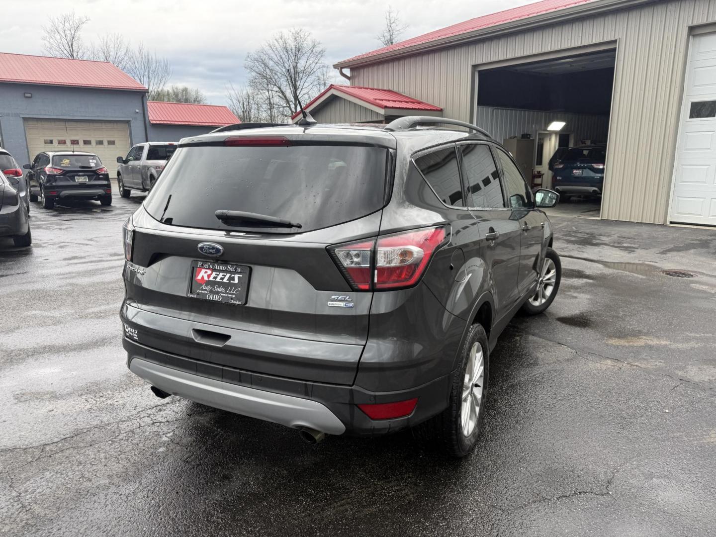 2018 Gray /Black Ford Escape SEL 4WD (1FMCU9HD0JU) with an 1.5L I4 DOHC 16V engine, Automatic transmission, located at 11115 Chardon Rd. , Chardon, OH, 44024, (440) 214-9705, 41.580246, -81.241943 - 2018 Ford Escape SEL 4WD – Turbo Efficiency, Premium Comfort, and All-Weather Confidence! This sharp 2018 Ford Escape SEL 4WD is a great-looking compact crossover that delivers style, comfort, and real capability! Powered by a responsive 1.5L I4 Turbocharged EcoBoost engine paired with a smooth 6 - Photo#29