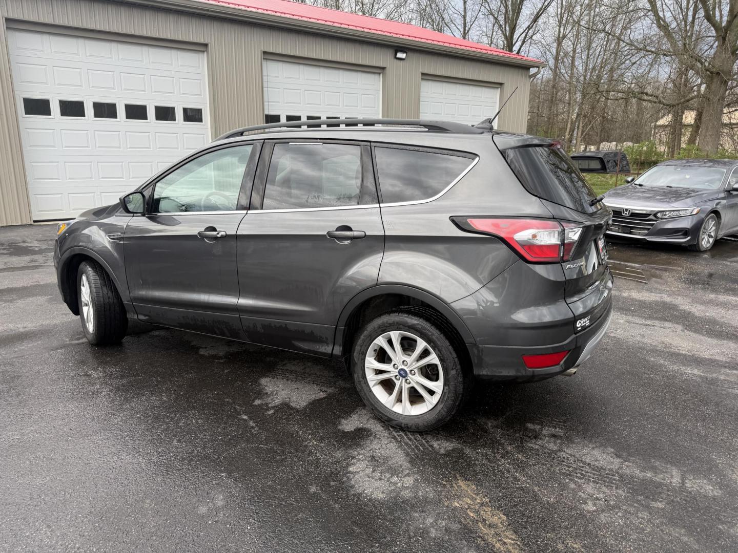 2018 Gray /Black Ford Escape SEL 4WD (1FMCU9HD0JU) with an 1.5L I4 DOHC 16V engine, Automatic transmission, located at 11115 Chardon Rd. , Chardon, OH, 44024, (440) 214-9705, 41.580246, -81.241943 - 2018 Ford Escape SEL 4WD – Turbo Efficiency, Premium Comfort, and All-Weather Confidence! This sharp 2018 Ford Escape SEL 4WD is a great-looking compact crossover that delivers style, comfort, and real capability! Powered by a responsive 1.5L I4 Turbocharged EcoBoost engine paired with a smooth 6 - Photo#32