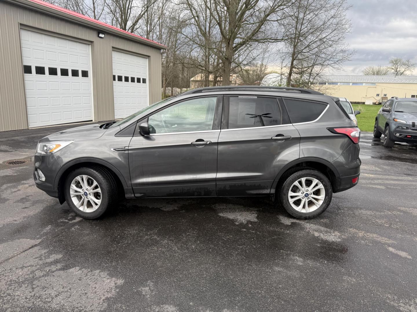 2018 Gray /Black Ford Escape SEL 4WD (1FMCU9HD0JU) with an 1.5L I4 DOHC 16V engine, Automatic transmission, located at 11115 Chardon Rd. , Chardon, OH, 44024, (440) 214-9705, 41.580246, -81.241943 - 2018 Ford Escape SEL 4WD – Turbo Efficiency, Premium Comfort, and All-Weather Confidence! This sharp 2018 Ford Escape SEL 4WD is a great-looking compact crossover that delivers style, comfort, and real capability! Powered by a responsive 1.5L I4 Turbocharged EcoBoost engine paired with a smooth 6 - Photo#34