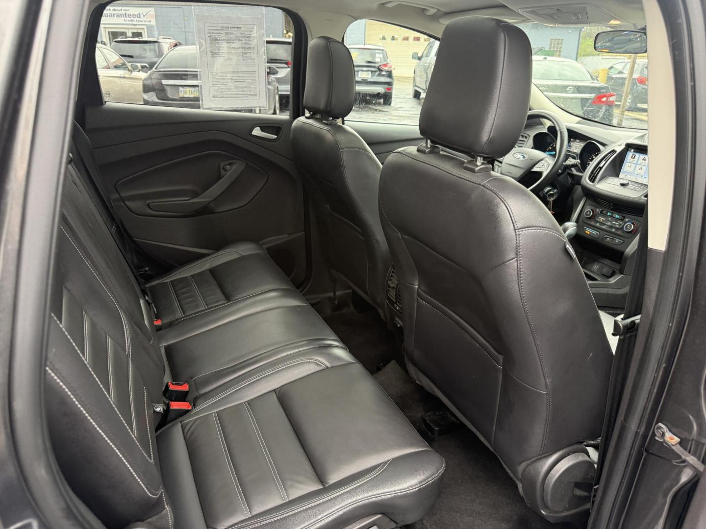 2018 Gray /Black Ford Escape SEL 4WD (1FMCU9HD0JU) with an 1.5L I4 DOHC 16V engine, Automatic transmission, located at 11115 Chardon Rd. , Chardon, OH, 44024, (440) 214-9705, 41.580246, -81.241943 - 2018 Ford Escape SEL 4WD – Turbo Efficiency, Premium Comfort, and All-Weather Confidence! This sharp 2018 Ford Escape SEL 4WD is a great-looking compact crossover that delivers style, comfort, and real capability! Powered by a responsive 1.5L I4 Turbocharged EcoBoost engine paired with a smooth 6 - Photo#40