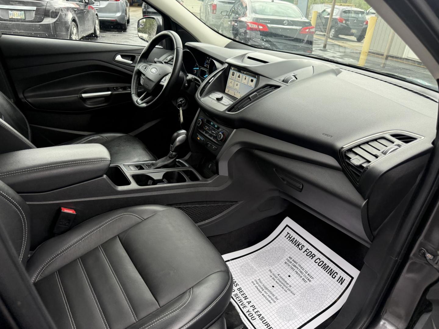 2018 Gray /Black Ford Escape SEL 4WD (1FMCU9HD0JU) with an 1.5L I4 DOHC 16V engine, Automatic transmission, located at 11115 Chardon Rd. , Chardon, OH, 44024, (440) 214-9705, 41.580246, -81.241943 - 2018 Ford Escape SEL 4WD – Turbo Efficiency, Premium Comfort, and All-Weather Confidence! This sharp 2018 Ford Escape SEL 4WD is a great-looking compact crossover that delivers style, comfort, and real capability! Powered by a responsive 1.5L I4 Turbocharged EcoBoost engine paired with a smooth 6 - Photo#42