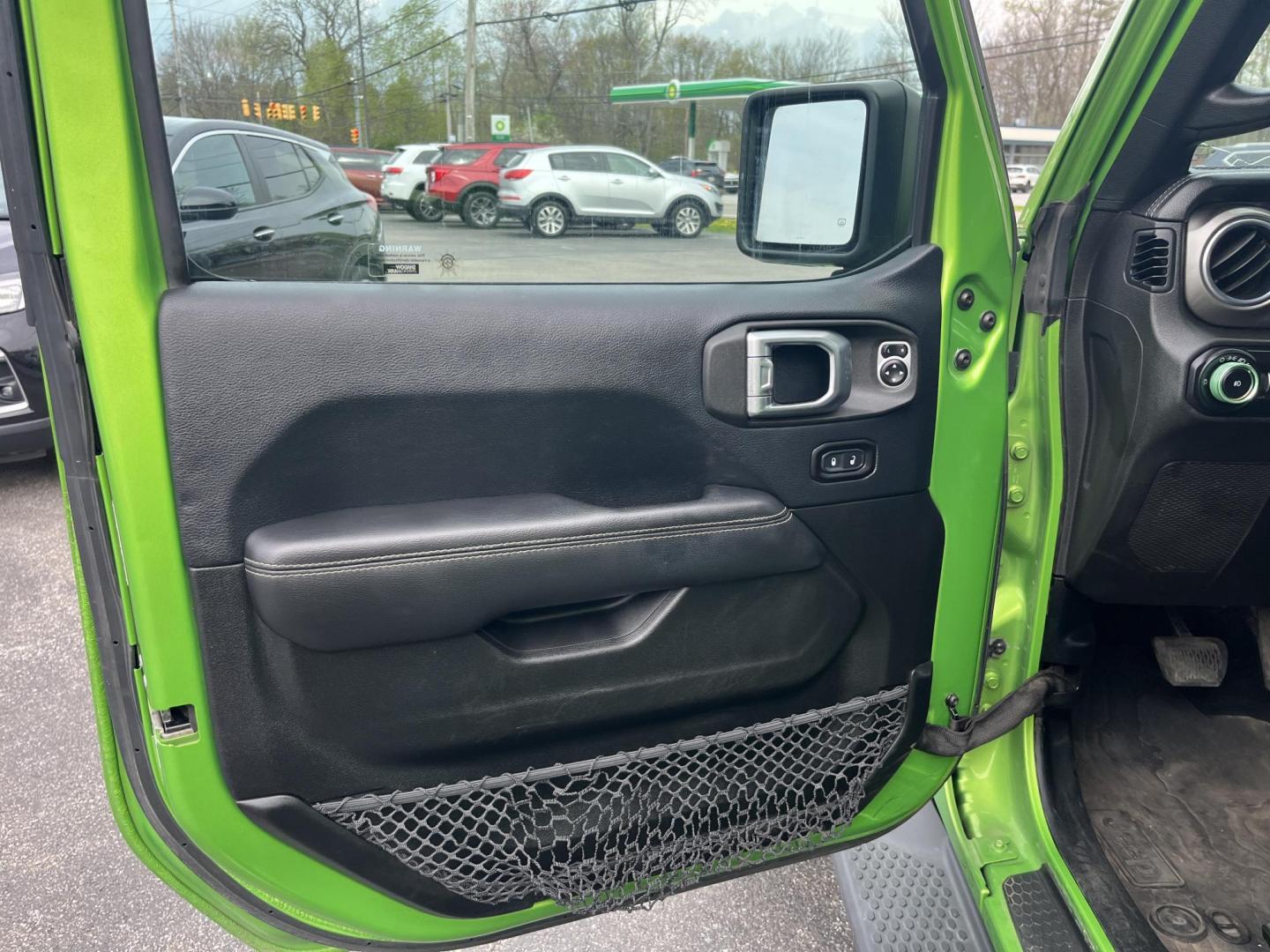 2018 Jeep Wrangler JK Unlimited Sahara (1C4HJXEG7JW) with an 3.6L V6 DOHC 24V FFV engine, 6A transmission, located at 547 E. Main St., Orwell, OH, 44076, (440) 437-5893, 41.535435, -80.847855 - Photo#16