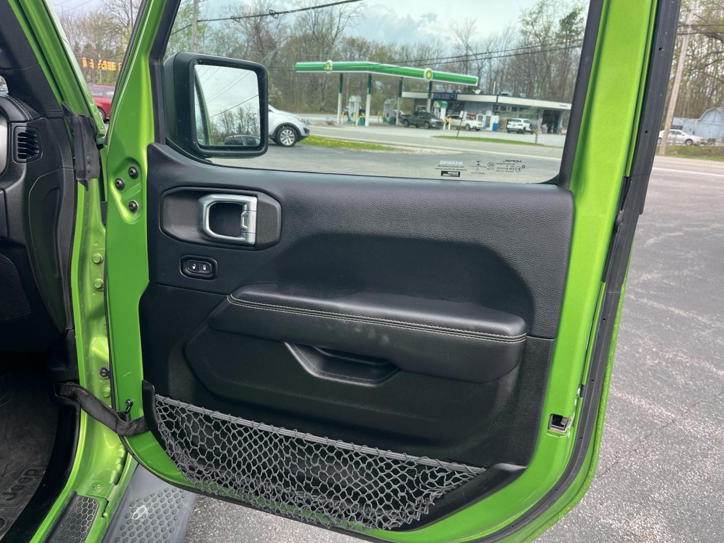 2018 Jeep Wrangler JK Unlimited Sahara (1C4HJXEG7JW) with an 3.6L V6 DOHC 24V FFV engine, 6A transmission, located at 547 E. Main St., Orwell, OH, 44076, (440) 437-5893, 41.535435, -80.847855 - Photo#35