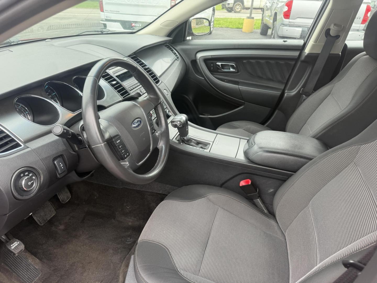 2012 Red /Black Ford Taurus SEL FWD (1FAHP2EWXCG) with an 3.5L V6 DOHC 24V engine, 6-Speed Automatic transmission, located at 11115 Chardon Rd. , Chardon, OH, 44024, (440) 214-9705, 41.580246, -81.241943 - 2012 Ford Taurus SEL FWD – Smooth, Spacious, and Efficient Full-Size Sedan! This 2012 Ford Taurus SEL FWD is a comfortable, well-equipped full-size sedan that offers roomy seating, smooth performance, and solid efficiency. Powered by a strong 3.5L V6 engine paired with a smooth 6-speed automatic - Photo#6