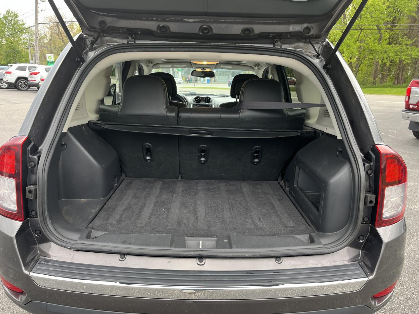 2016 Gray /Black Jeep Compass High Altitude 4WD (1C4NJDEB2GD) with an 2.4L I4 DOHC 16V engine, Automatic transmission, located at 11115 Chardon Rd. , Chardon, OH, 44024, (440) 214-9705, 41.580246, -81.241943 - 2016 Jeep Compass High Altitude 4WD – Premium Leather, Sunroof, and All-Weather Capability! This 2016 Jeep Compass High Altitude 4WD is a sharp, well-equipped compact SUV that offers upscale comfort with real Jeep capability. Powered by a reliable 2.4L I4 engine paired with a smooth 6-speed autom - Photo#14