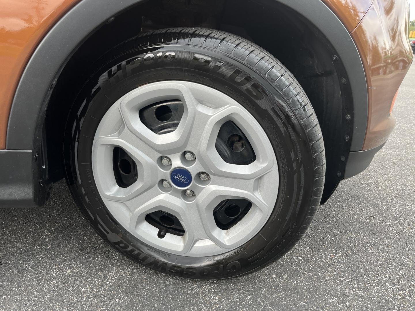 2017 Orange /Black Ford Escape S FWD (1FMCU0F7XHU) with an 2.5L I4 DOHC 16V engine, Automatic transmission, located at 11115 Chardon Rd. , Chardon, OH, 44024, (440) 214-9705, 41.580246, -81.241943 - Photo#4
