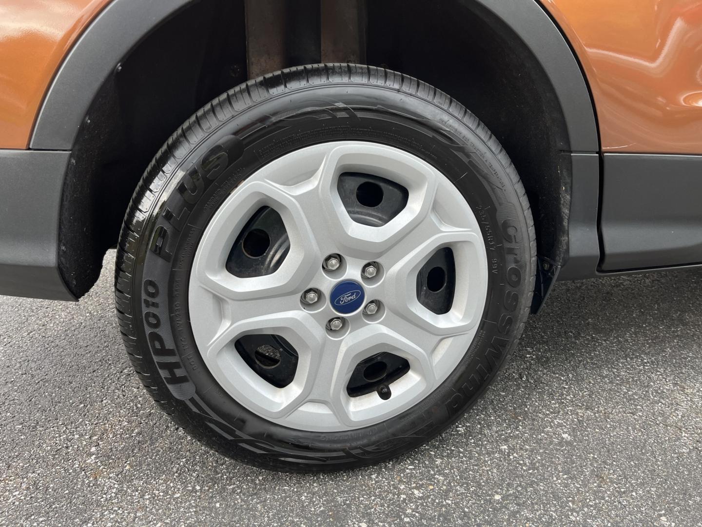 2017 Orange /Black Ford Escape S FWD (1FMCU0F7XHU) with an 2.5L I4 DOHC 16V engine, Automatic transmission, located at 11115 Chardon Rd. , Chardon, OH, 44024, (440) 214-9705, 41.580246, -81.241943 - Photo#7