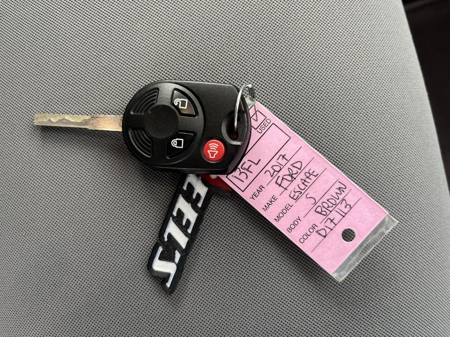 2017 Orange /Black Ford Escape S FWD (1FMCU0F7XHU) with an 2.5L I4 DOHC 16V engine, Automatic transmission, located at 11115 Chardon Rd. , Chardon, OH, 44024, (440) 214-9705, 41.580246, -81.241943 - Photo#34