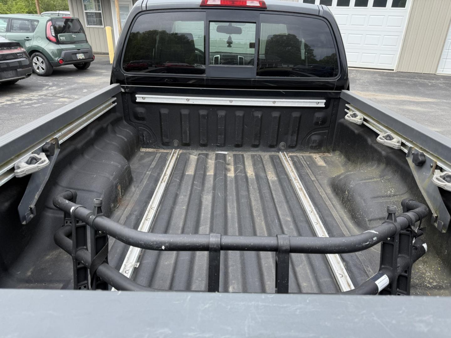 2014 Black /Gray Nissan Frontier SV King Cab 5AT 4WD (1N6AD0CW4EN) with an 4.0L V6 DOHC 24V engine, Automatic transmission, located at 11115 Chardon Rd. , Chardon, OH, 44024, (440) 214-9705, 41.580246, -81.241943 - 2014 Nissan Frontier SV King Cab 4WD – Tough, Reliable Midsize Truck with Fresh Service! This 2014 Nissan Frontier SV King Cab 4WD is a rugged and dependable midsize pickup that’s built to last and ready for work or weekend adventures. Powered by the proven 4.0L V6 engine paired with a durable - Photo#7