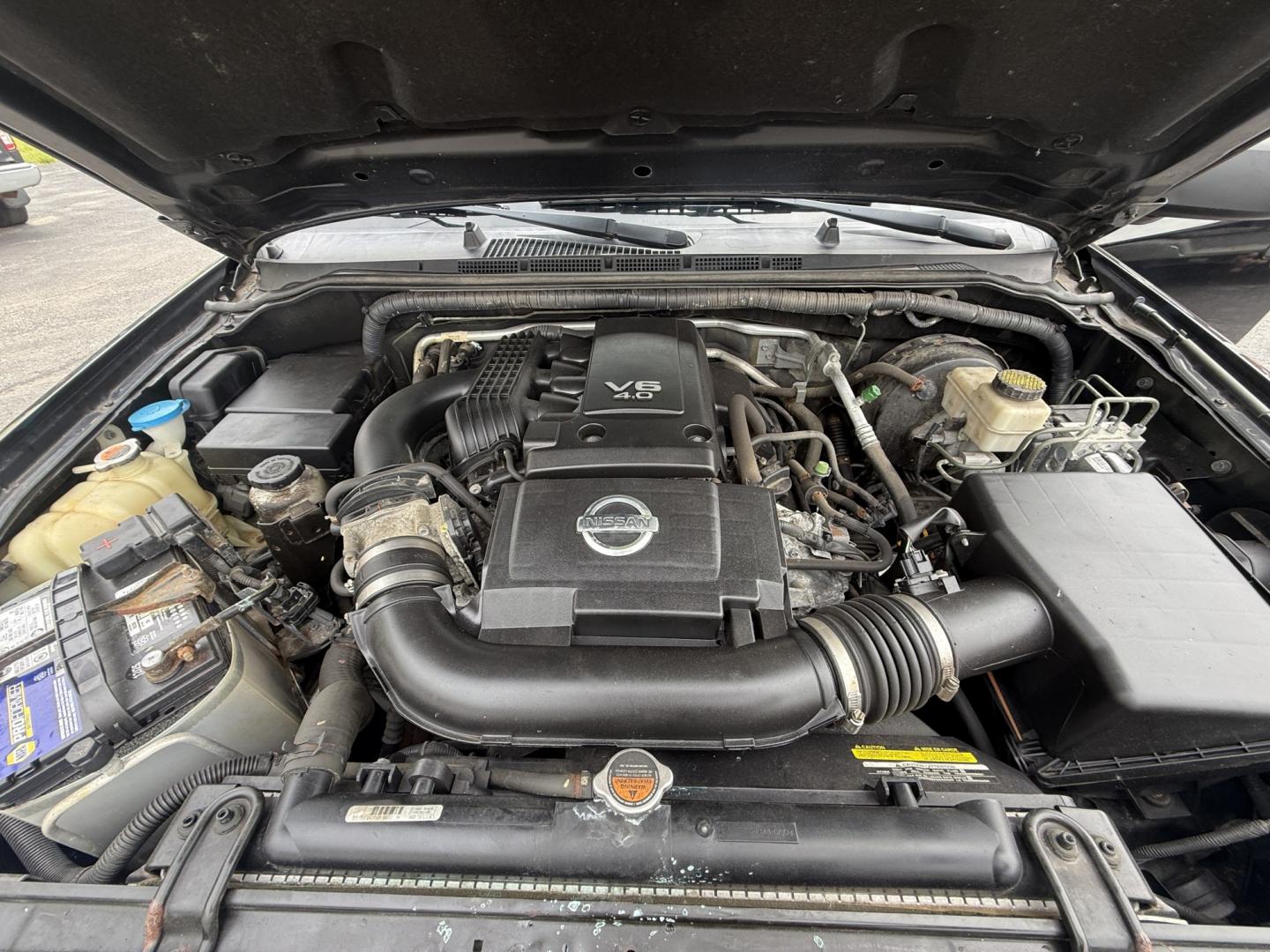 2014 Black /Gray Nissan Frontier SV King Cab 5AT 4WD (1N6AD0CW4EN) with an 4.0L V6 DOHC 24V engine, Automatic transmission, located at 11115 Chardon Rd. , Chardon, OH, 44024, (440) 214-9705, 41.580246, -81.241943 - 2014 Nissan Frontier SV King Cab 4WD – Tough, Reliable Midsize Truck with Fresh Service! This 2014 Nissan Frontier SV King Cab 4WD is a rugged and dependable midsize pickup that’s built to last and ready for work or weekend adventures. Powered by the proven 4.0L V6 engine paired with a durable - Photo#8