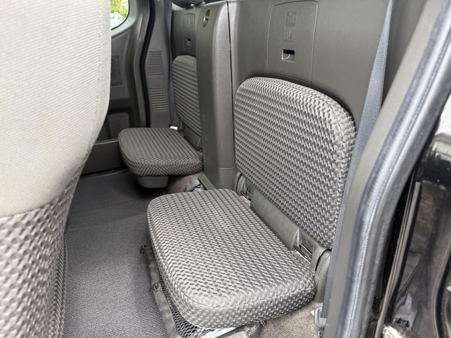 2014 Black /Gray Nissan Frontier SV King Cab 5AT 4WD (1N6AD0CW4EN) with an 4.0L V6 DOHC 24V engine, Automatic transmission, located at 11115 Chardon Rd. , Chardon, OH, 44024, (440) 214-9705, 41.580246, -81.241943 - 2014 Nissan Frontier SV King Cab 4WD – Tough, Reliable Midsize Truck with Fresh Service! This 2014 Nissan Frontier SV King Cab 4WD is a rugged and dependable midsize pickup that’s built to last and ready for work or weekend adventures. Powered by the proven 4.0L V6 engine paired with a durable - Photo#23