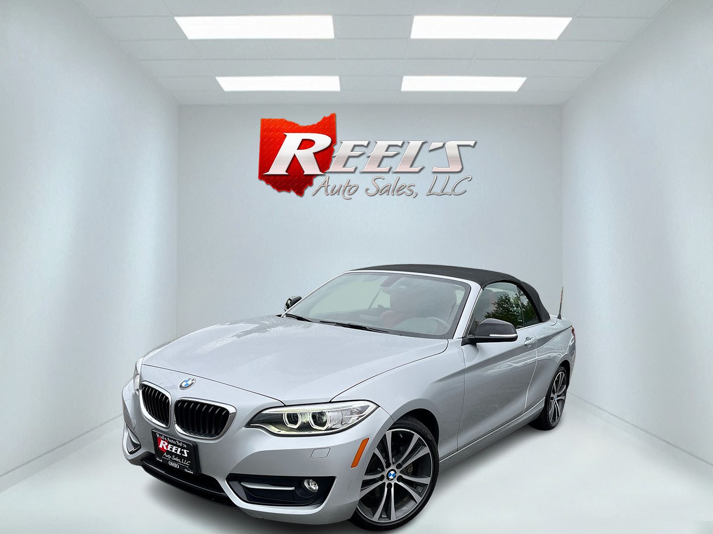 2015 Silver /Red BMW 2-Series 228xi Convertible (WBA1K7C55FV) with an 2.0L I4 DOHC 16V Turbo engine, Automatic transmission, located at 11115 Chardon Rd. , Chardon, OH, 44024, (440) 214-9705, 41.580246, -81.241943 - 2015 BMW 228i xDrive Convertible – Sporty Turbo Drop-Top with Premium Red Leather and xDrive Confidence! This 2015 BMW 228i xDrive Convertible is a fun, stylish, and capable premium convertible that offers the perfect blend of performance and open-air enjoyment. Powered by a responsive 2.0L Turbo - Photo#1