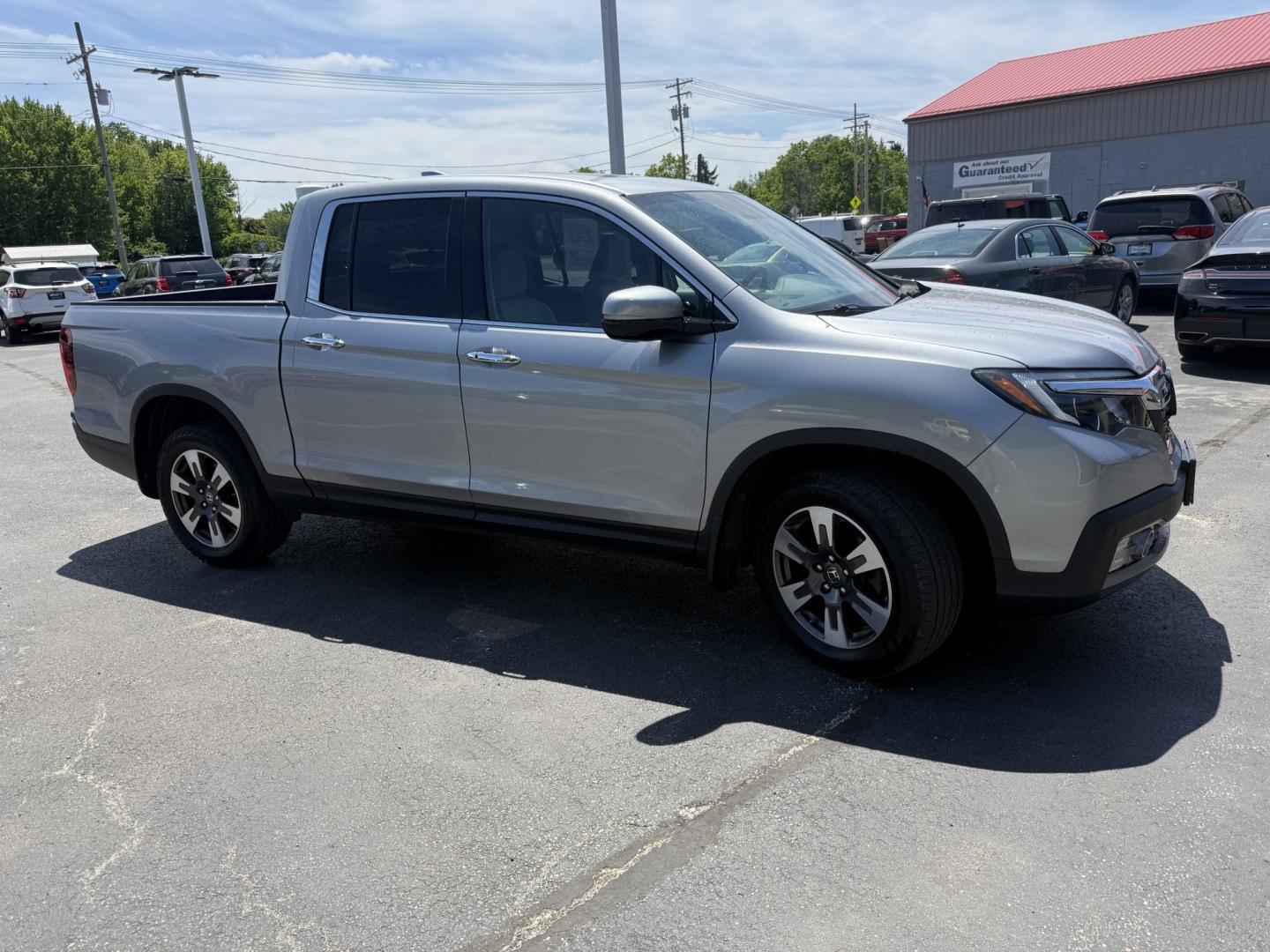 2018 Silver /Gray Honda Ridgeline RTL-E AWD (5FPYK3F79JB) with an 3.5L V6 SOHC 24V engine, Automatic transmission, located at 547 E. Main St., Orwell, OH, 44076, (440) 437-5893, 41.535435, -80.847855 - 2018 Honda Ridgeline RTL-E AWD – Premium Mid-Size Truck with Leather, Strong Towing, and Loaded Features! This sharp 2018 Honda Ridgeline RTL-E AWD is a refined and capable truck that combines car-like comfort with real truck utility. Powered by Honda’s smooth 3.5L Earth Dreams V6 engine paired - Photo#3