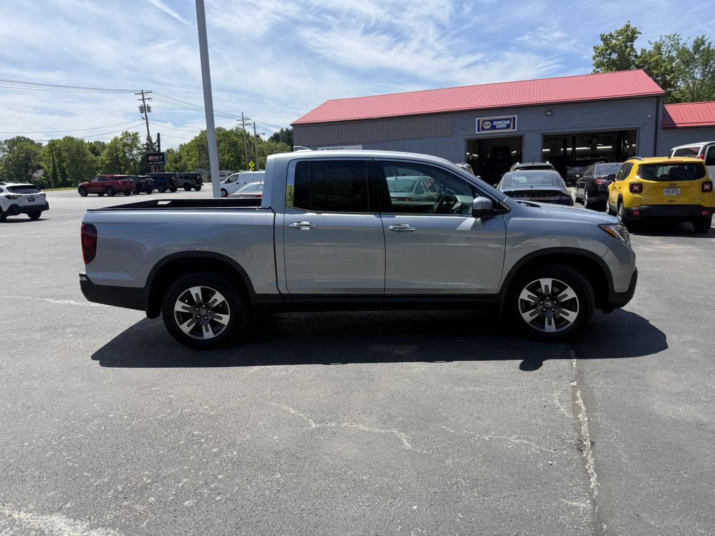2018 Silver /Gray Honda Ridgeline RTL-E AWD (5FPYK3F79JB) with an 3.5L V6 SOHC 24V engine, Automatic transmission, located at 547 E. Main St., Orwell, OH, 44076, (440) 437-5893, 41.535435, -80.847855 - 2018 Honda Ridgeline RTL-E AWD – Premium Mid-Size Truck with Leather, Strong Towing, and Loaded Features! This sharp 2018 Honda Ridgeline RTL-E AWD is a refined and capable truck that combines car-like comfort with real truck utility. Powered by Honda’s smooth 3.5L Earth Dreams V6 engine paired - Photo#29