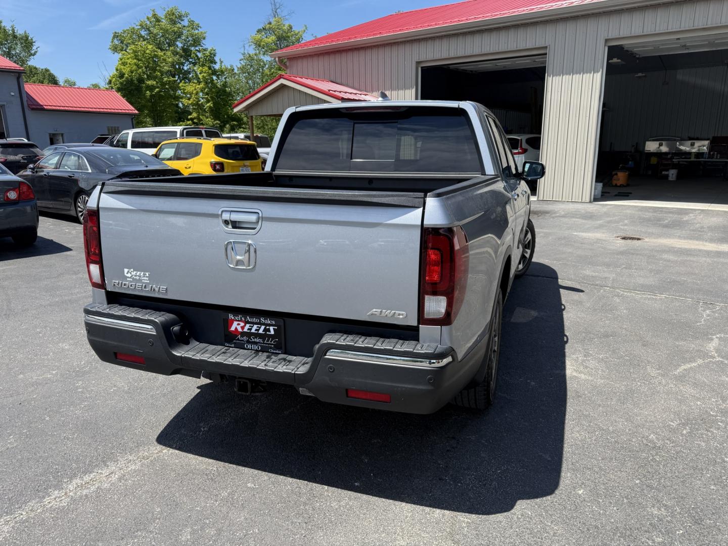 2018 Silver /Gray Honda Ridgeline RTL-E AWD (5FPYK3F79JB) with an 3.5L V6 SOHC 24V engine, Automatic transmission, located at 547 E. Main St., Orwell, OH, 44076, (440) 437-5893, 41.535435, -80.847855 - 2018 Honda Ridgeline RTL-E AWD – Premium Mid-Size Truck with Leather, Strong Towing, and Loaded Features! This sharp 2018 Honda Ridgeline RTL-E AWD is a refined and capable truck that combines car-like comfort with real truck utility. Powered by Honda’s smooth 3.5L Earth Dreams V6 engine paired - Photo#31
